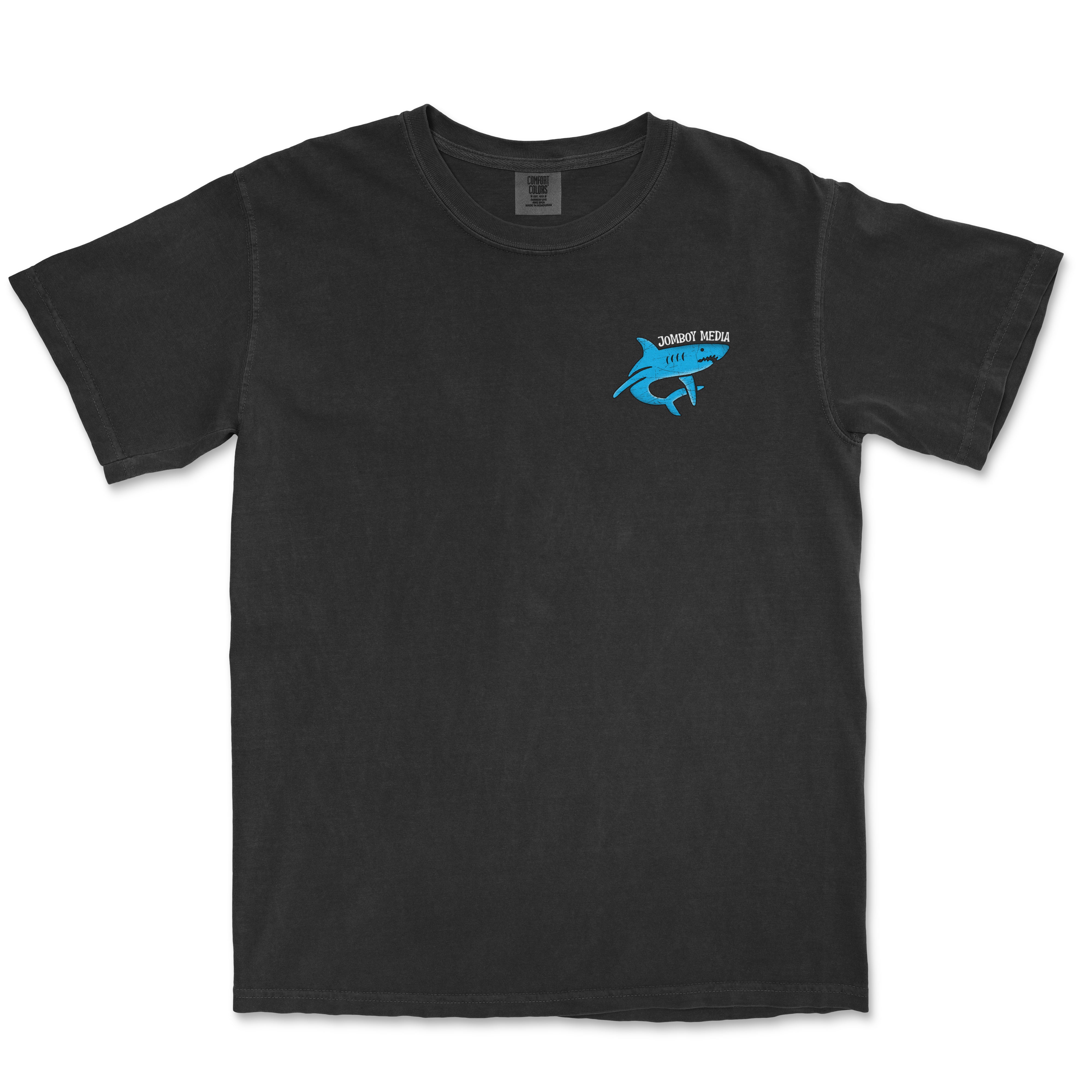 Black Comfort Colors T-shirt with a small blue shark graphic and "Jomboy Media" text on the chest.