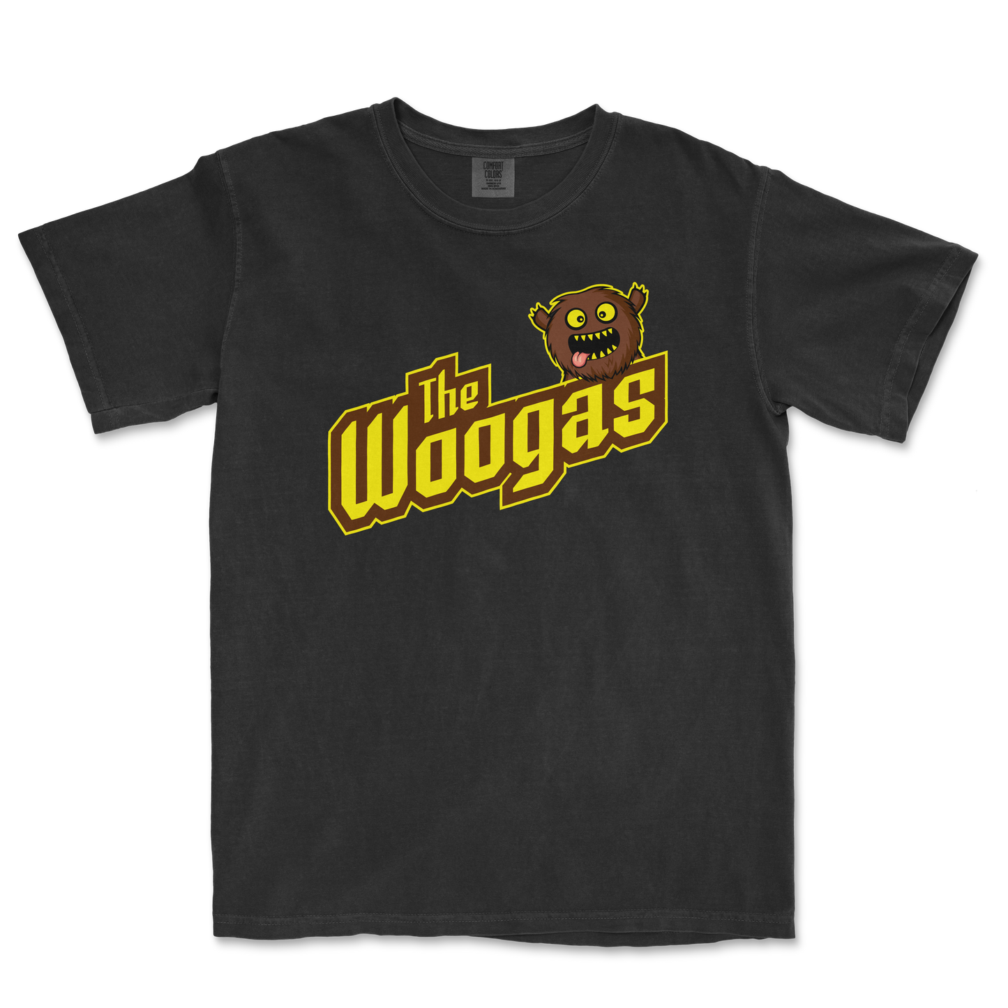 Black T-shirt featuring a cartoon monster head with yellow eyes and sharp teeth, alongside the text "the Woogas" in bold yellow and brown letters.
