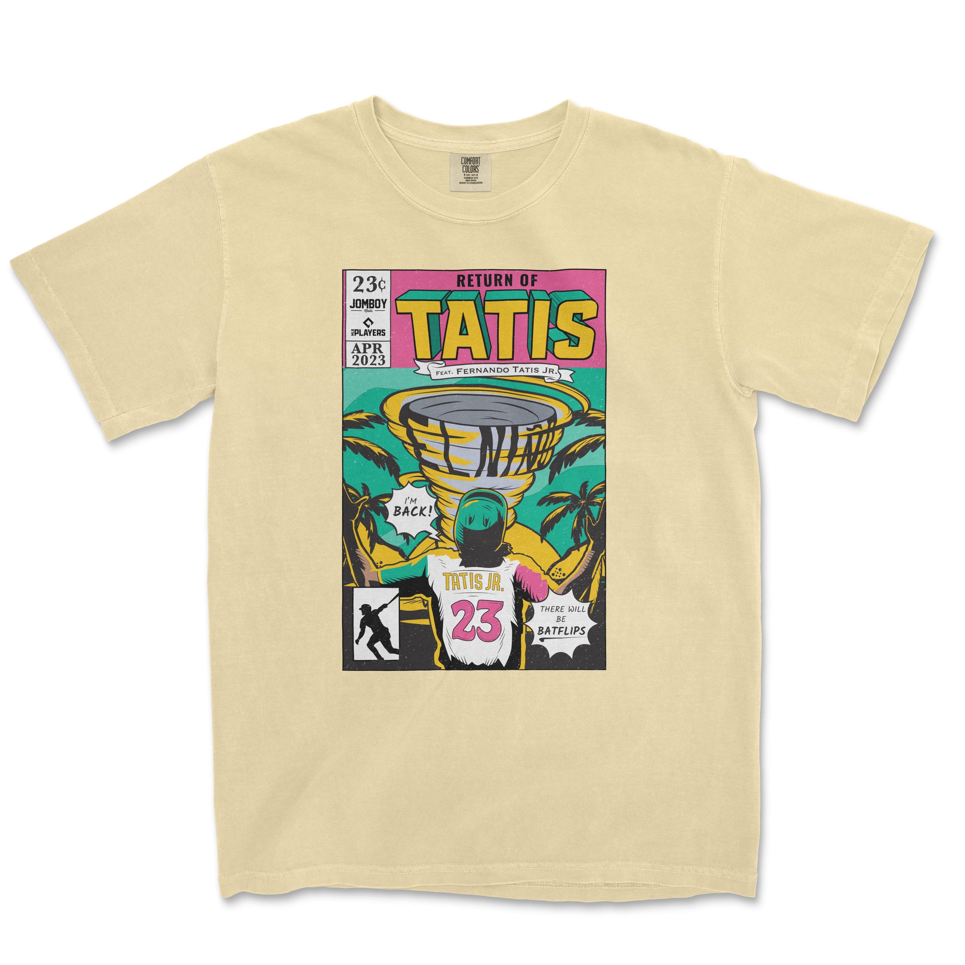 Alt text: "Tatís Returns" Comic Edition beige Comfort Colors t-shirt featuring a vibrant, comic book-style graphic print with a baseball player, tropical design, and text highlighting "Return of TATÍS, Jomboy Media, Players