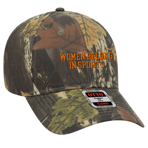 Camouflage baseball cap with orange embroidered text "Women Belong in Sports" and a curved brim featuring a leaf pattern.