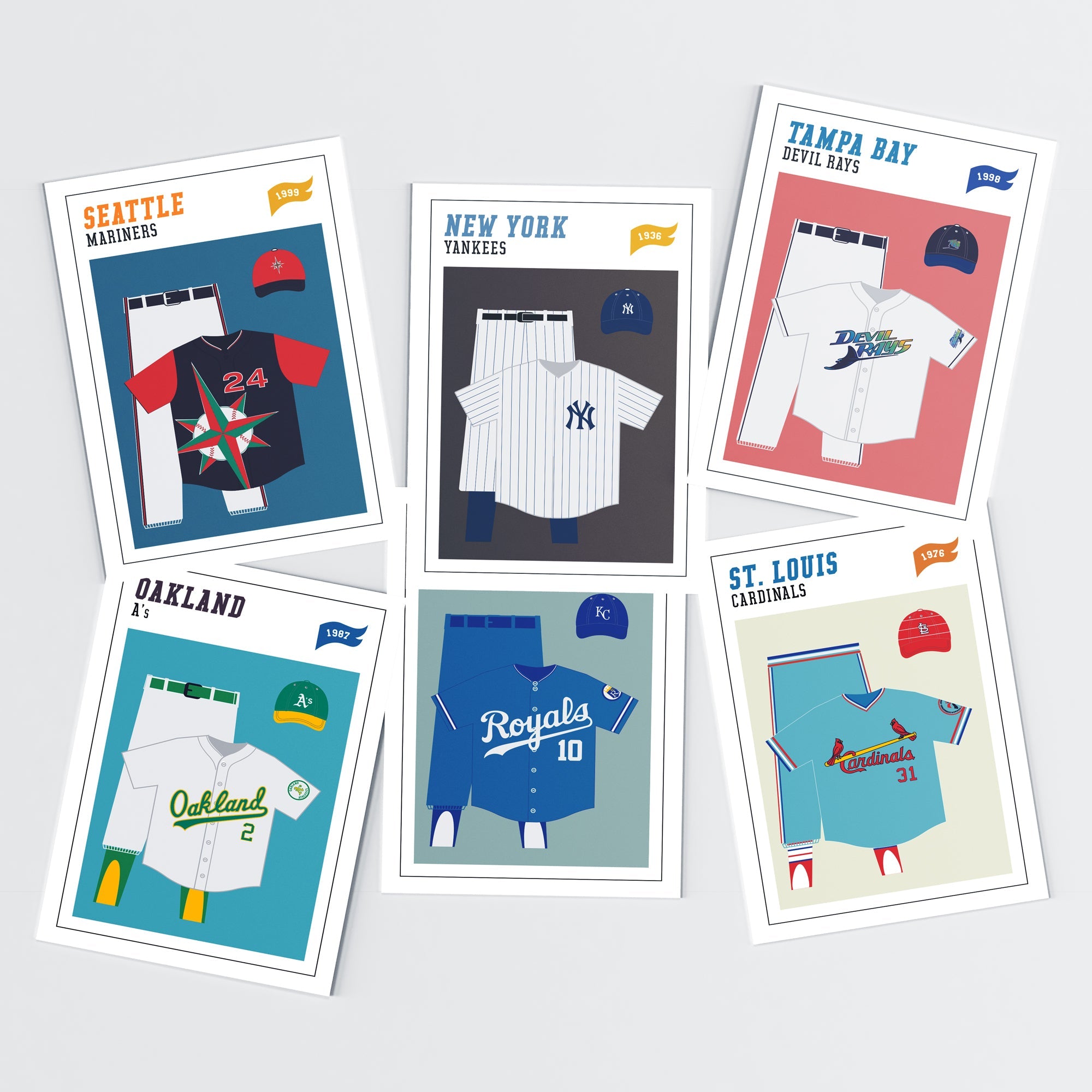 Set of six baseball uniform collage cards featuring team jerseys, caps, and logos from Seattle Mariners, New York Yankees, Tampa Bay Devil Rays, Oakland Athletics, Kansas City Royals, and St. Louis Cardinals.