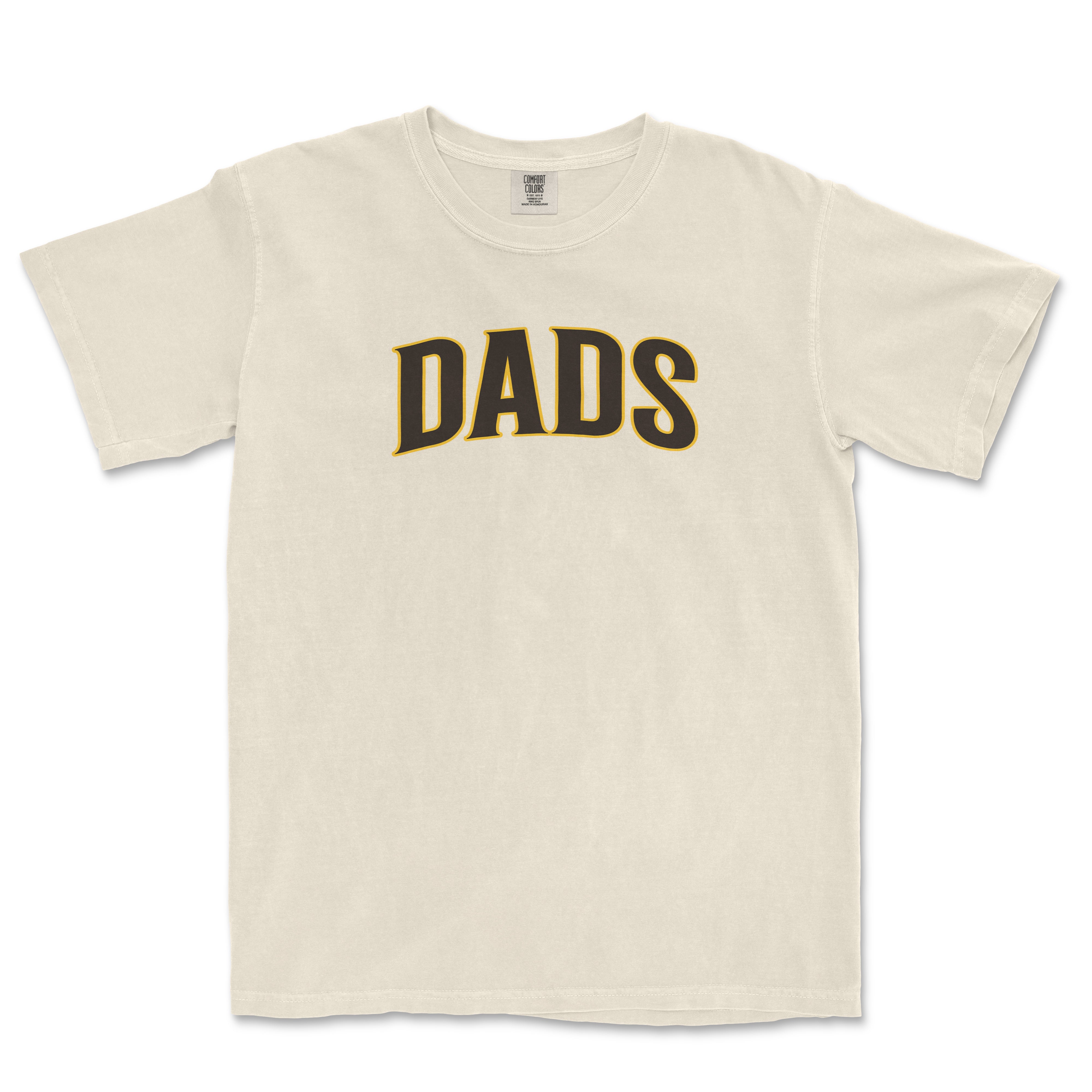 Beige T-shirt with bold black and gold "DADS" text printed across the front, casual style, short sleeves, and round neckline.