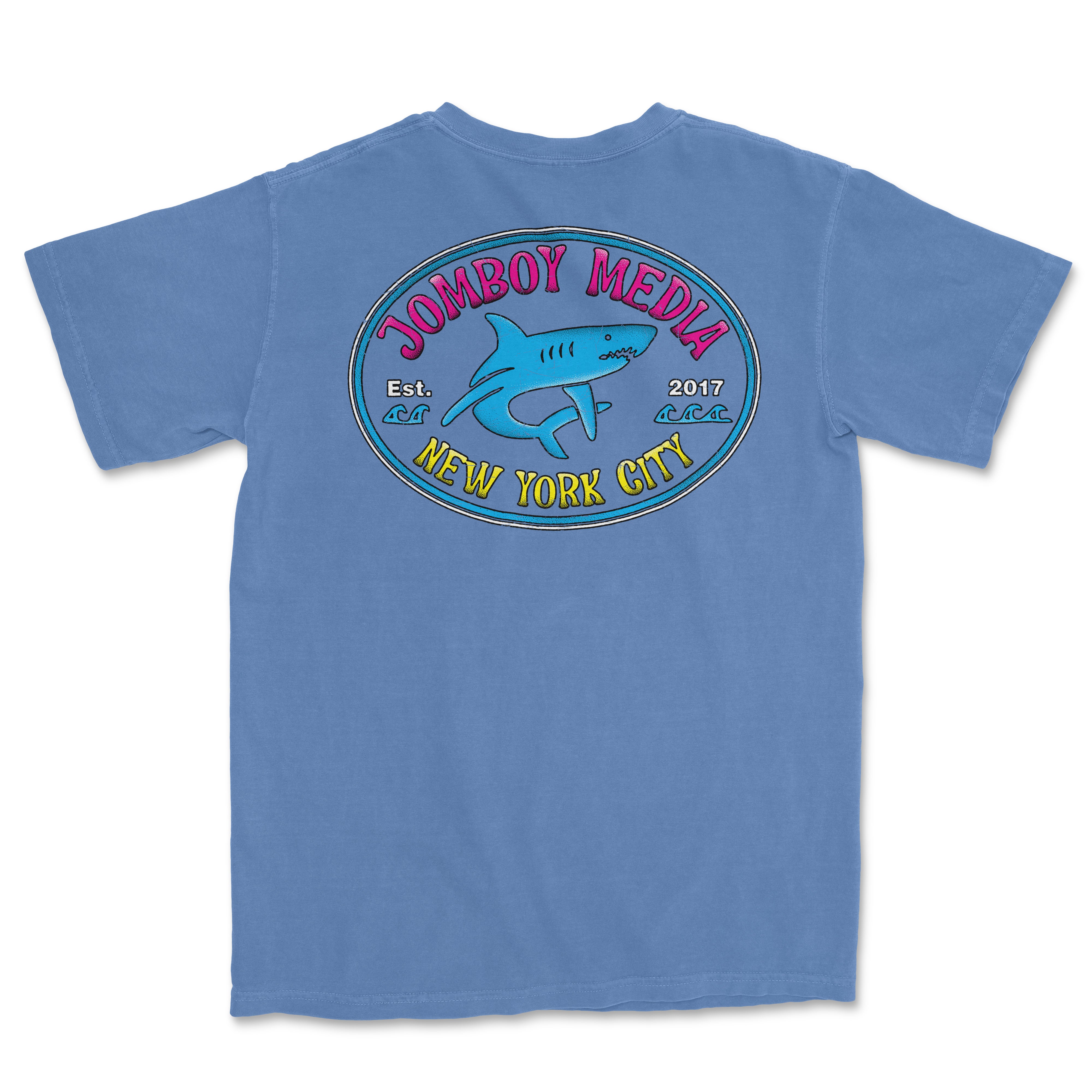 Blue Comfort Colors T-shirt featuring a colorful "Locals Only" design with a shark, fish, and "Jombooy Media" text, established 2017, in New York City.