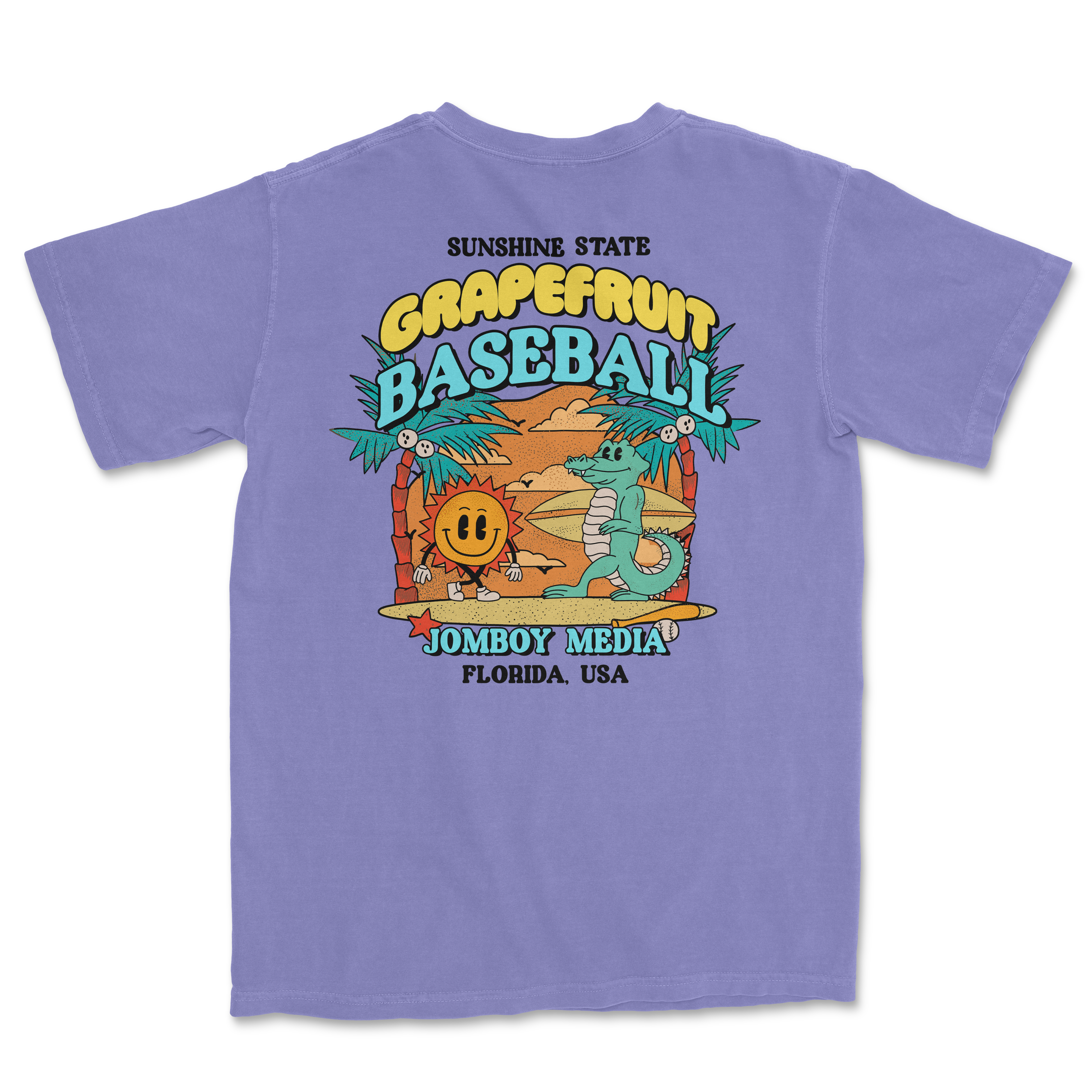 Lavender Comfort Colors T-shirt featuring a colorful Grapefruit Baseball design with a sun, palm trees, and cartoon characters.
