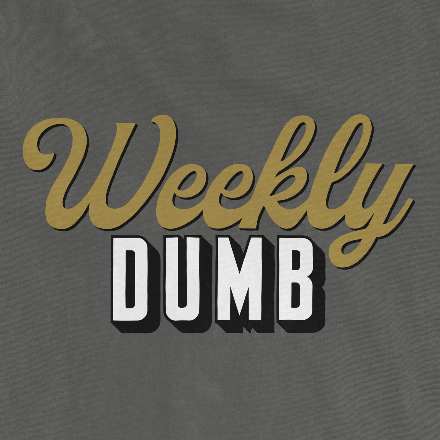 Gray fabric with the phrase "Weekly DUMB" in gold cursive and bold black-and-white block letters.