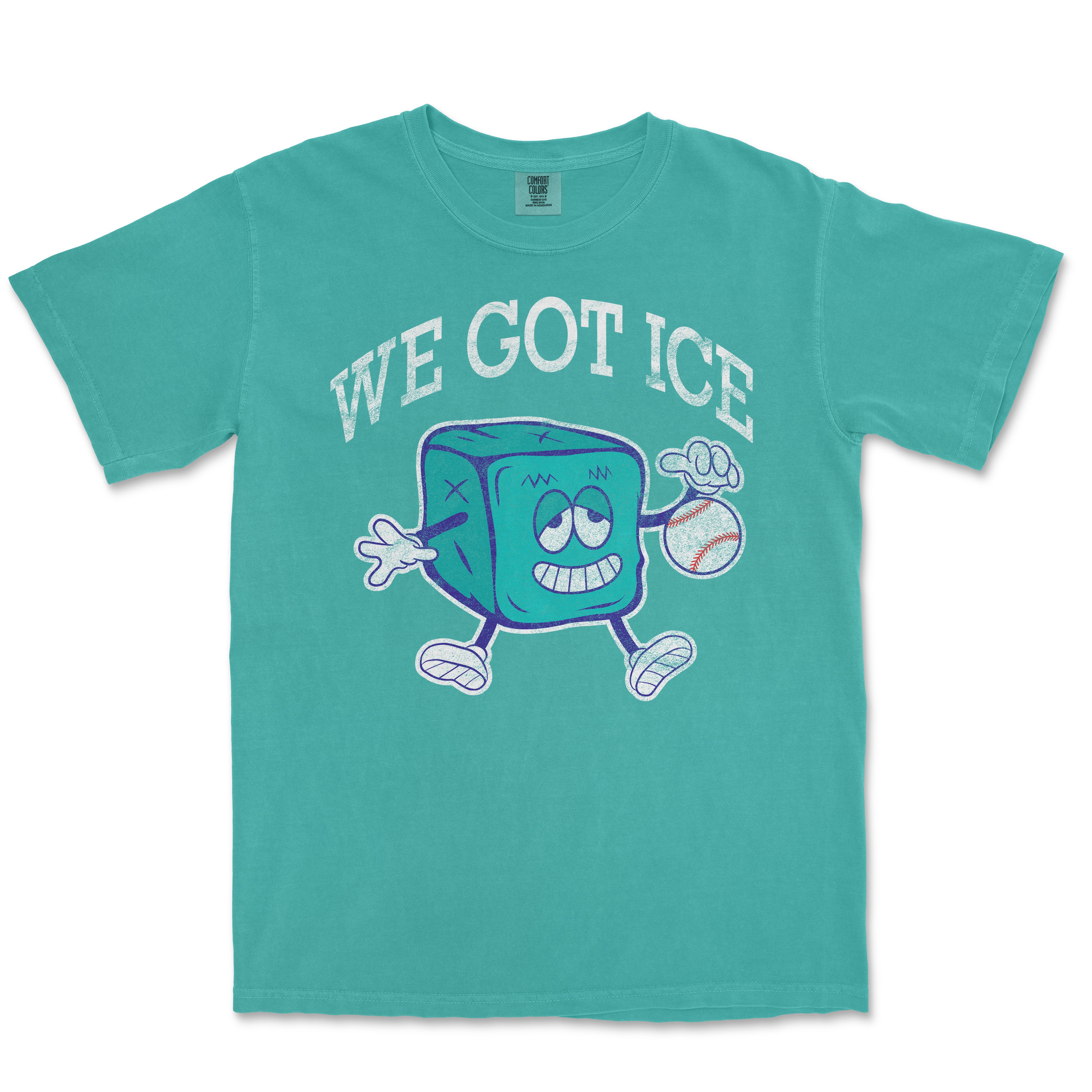 A teal T-shirt featuring a cartoon ice cube mascot holding a baseball, with the text "We Got Ice" in bold white letters above.