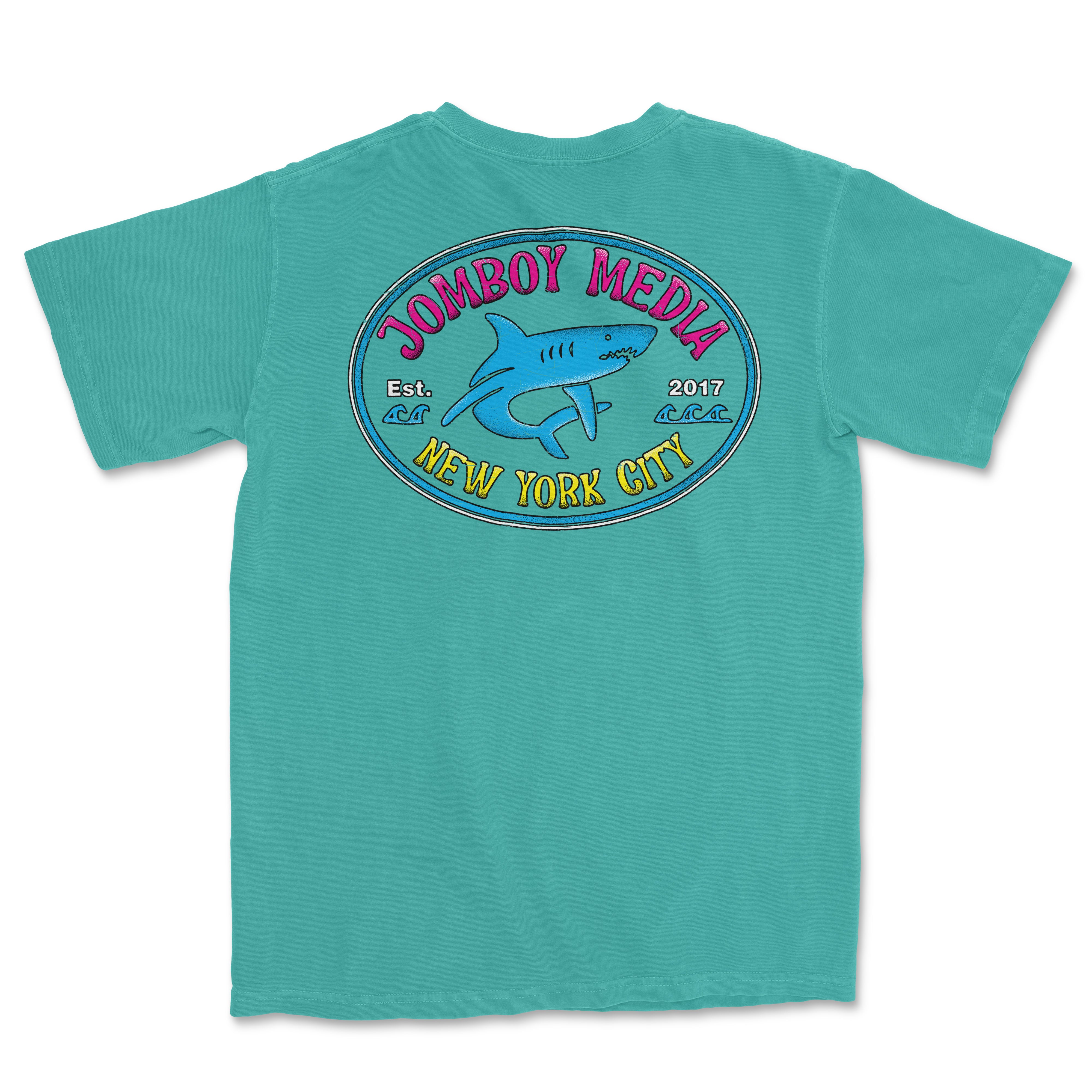 Turquoise Comfort Colors tee featuring a "Locals Only" design with a shark, "Jombooy Media," and "New York City" text on the back.