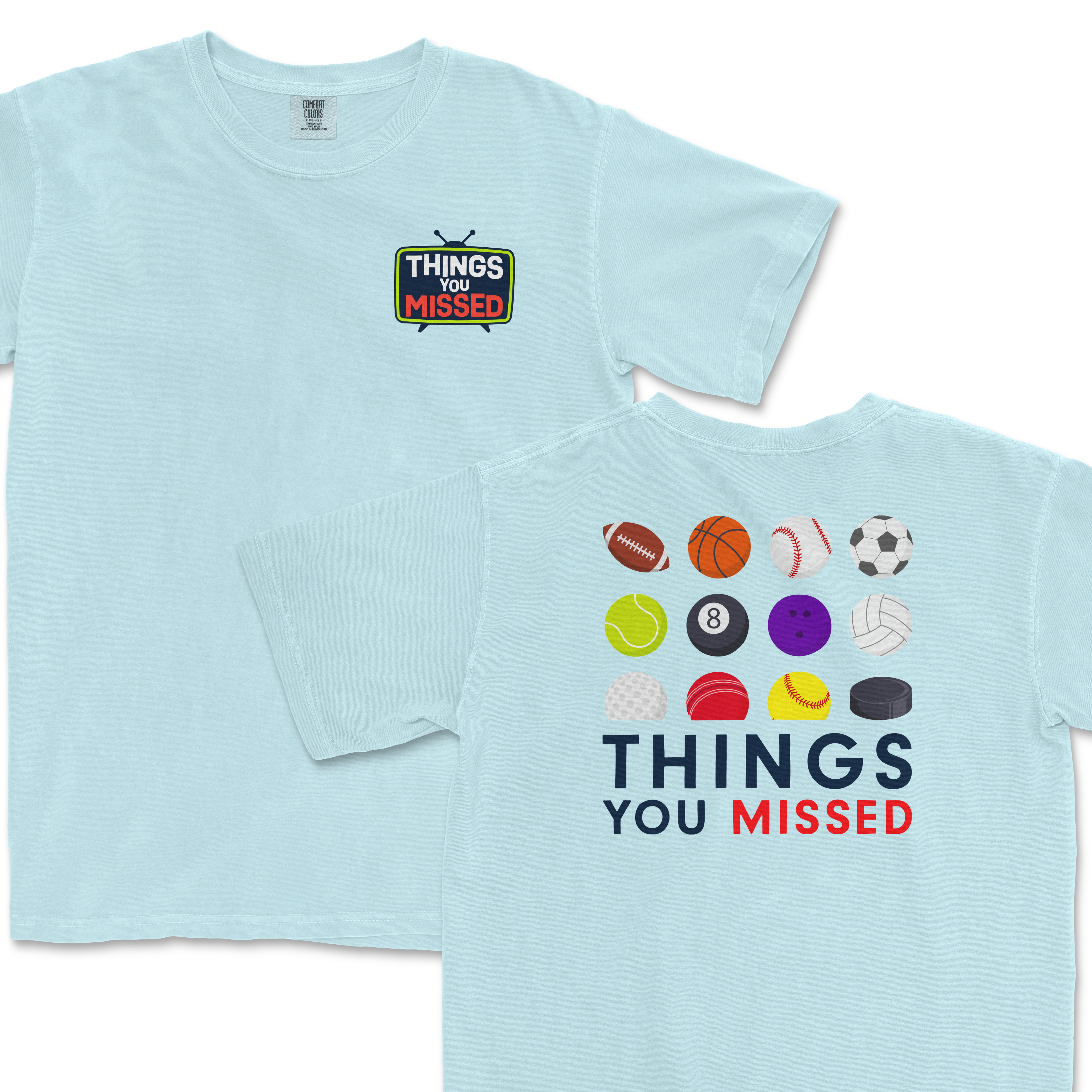 Light blue T-shirt featuring a "Things You Missed" design with sports balls on the back and a small logo on the front.