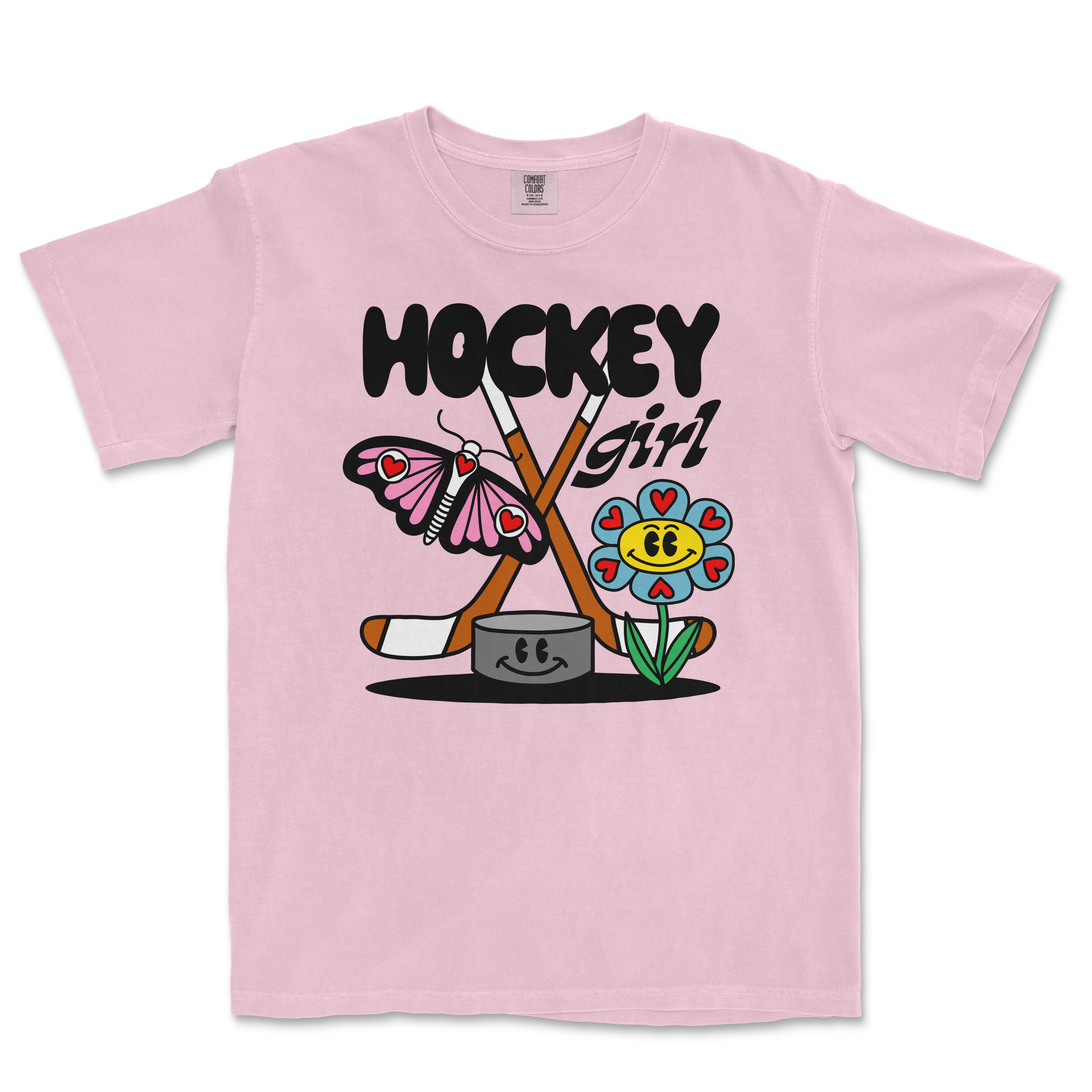 Pink Comfort Colors tee featuring a colorful cartoon design of a butterfly, flower, hockey sticks, and the text "Hockey Girl.