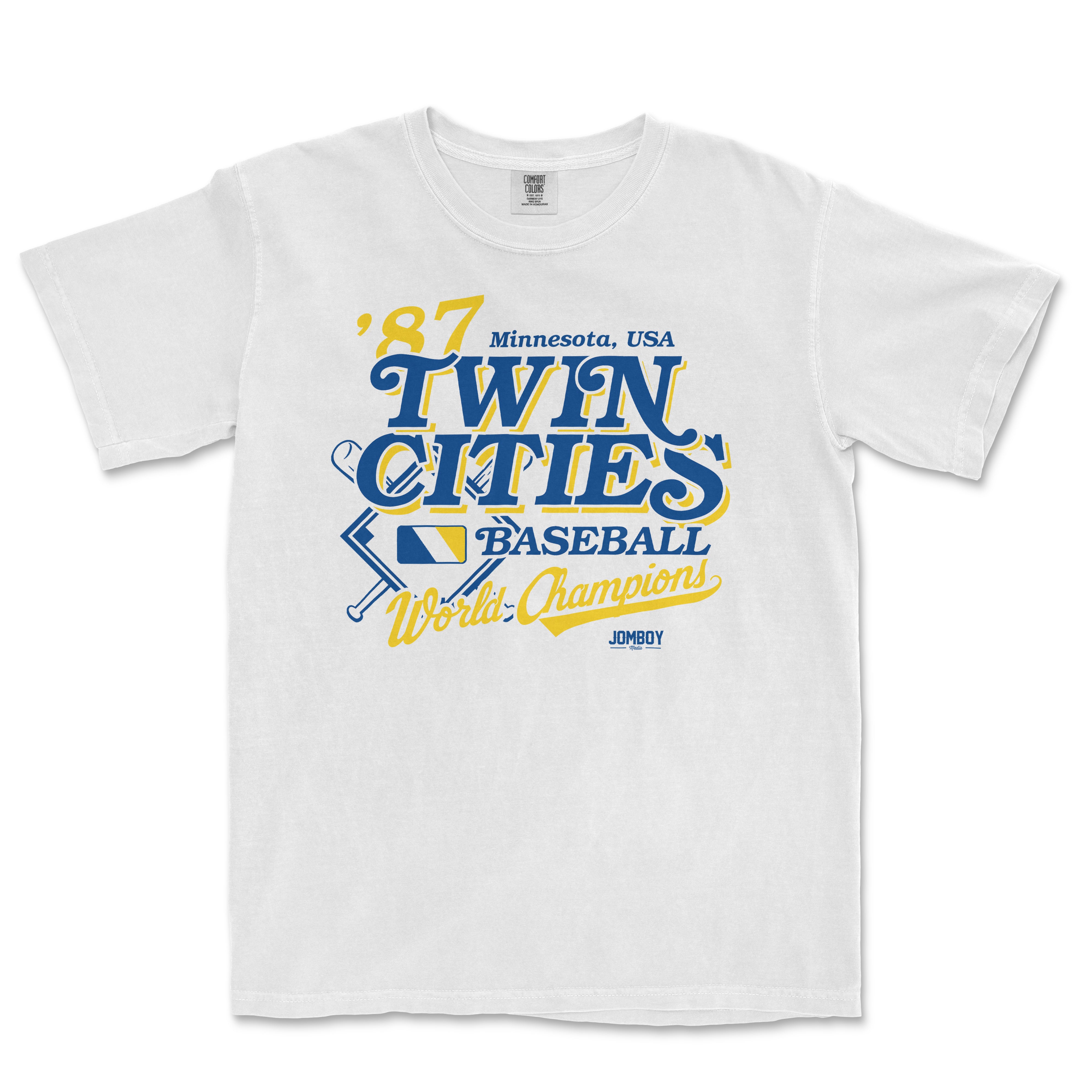 White Comfort Colors tee featuring vintage Minnesota Twins baseball design with blue and yellow text and graphics.