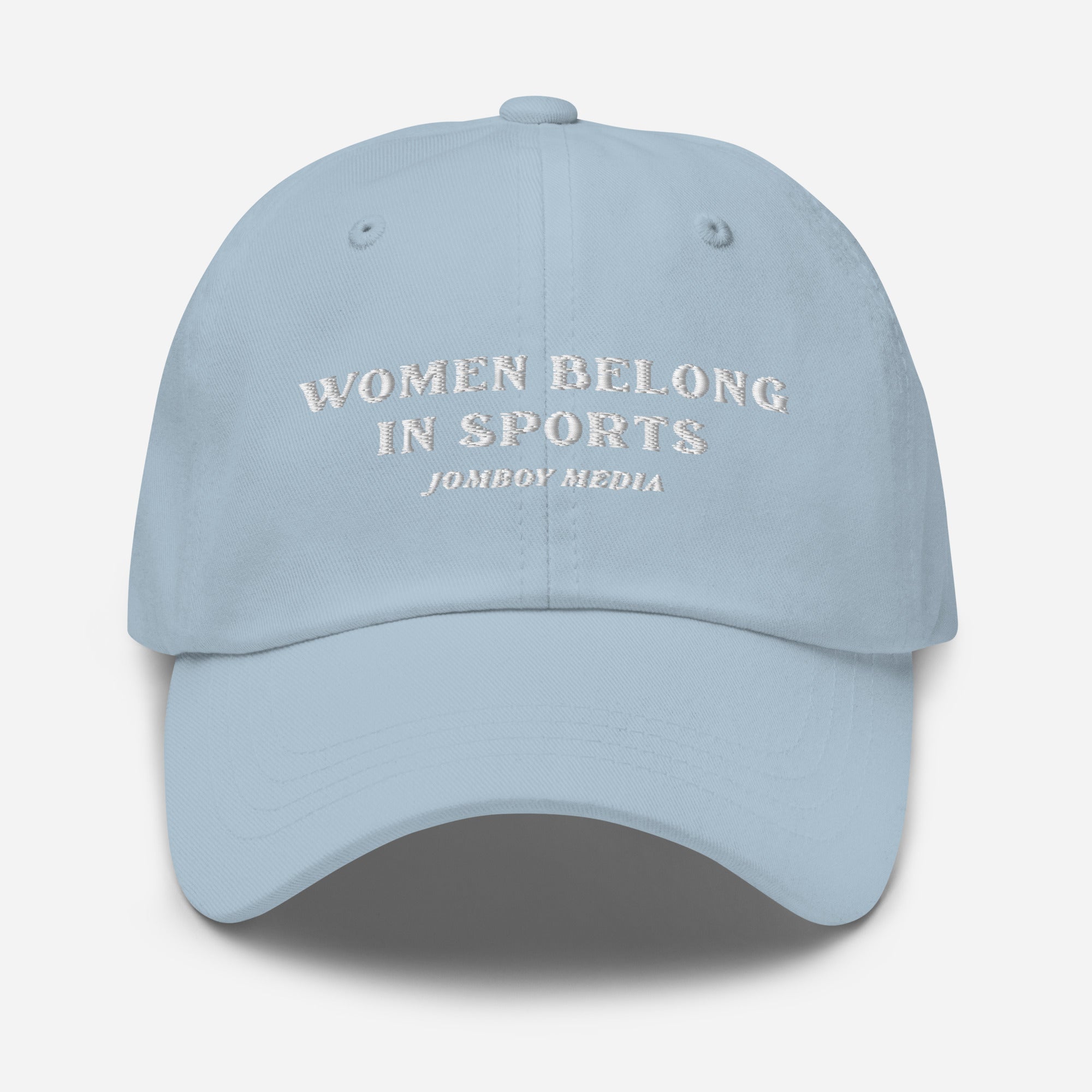 Light blue dad hat with embroidered text: "Women Belong in Sports" and "Jombo Media" underneath.