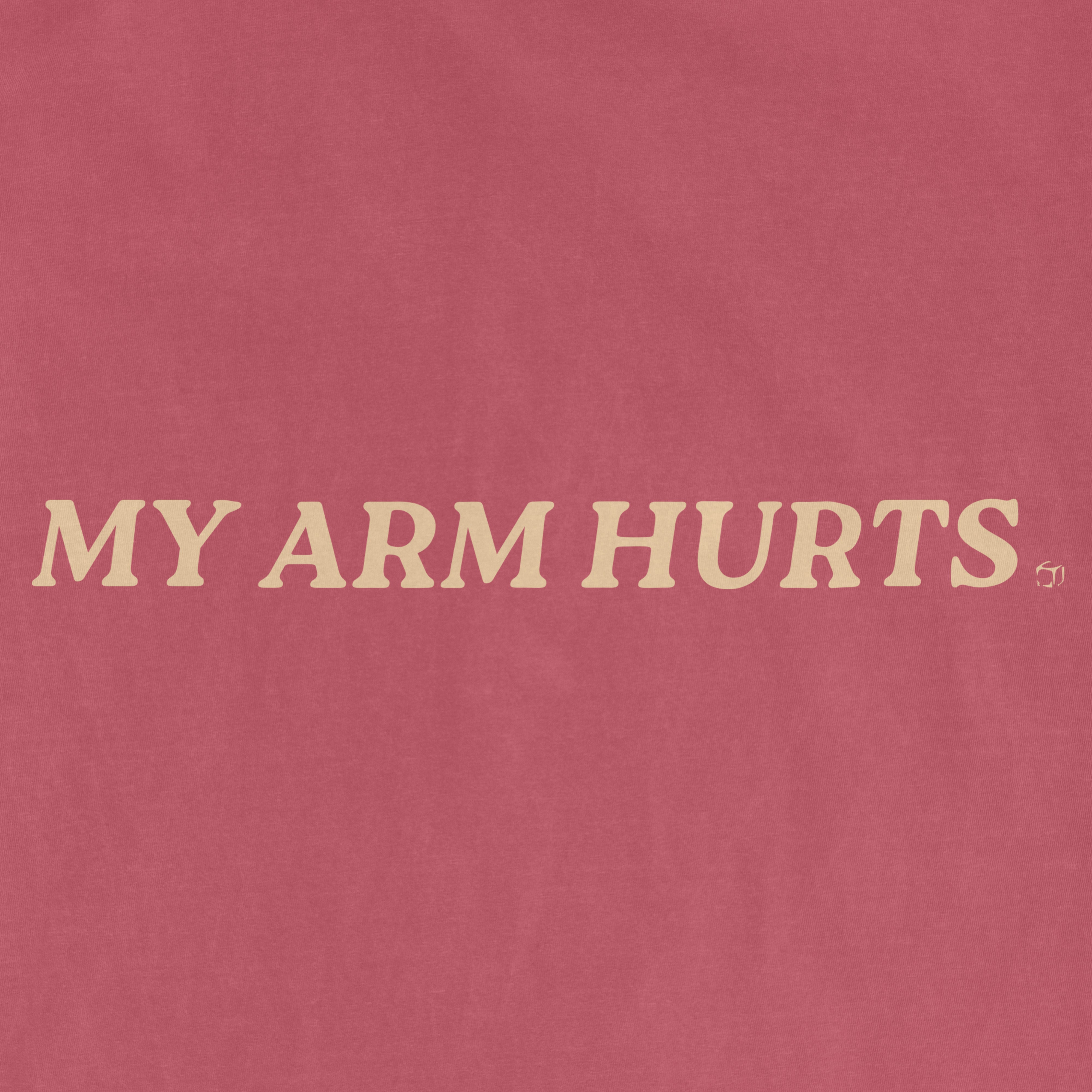 Pink vintage Comfort Colors® tee with the phrase "MY ARM HURTS" printed in beige text across the front.