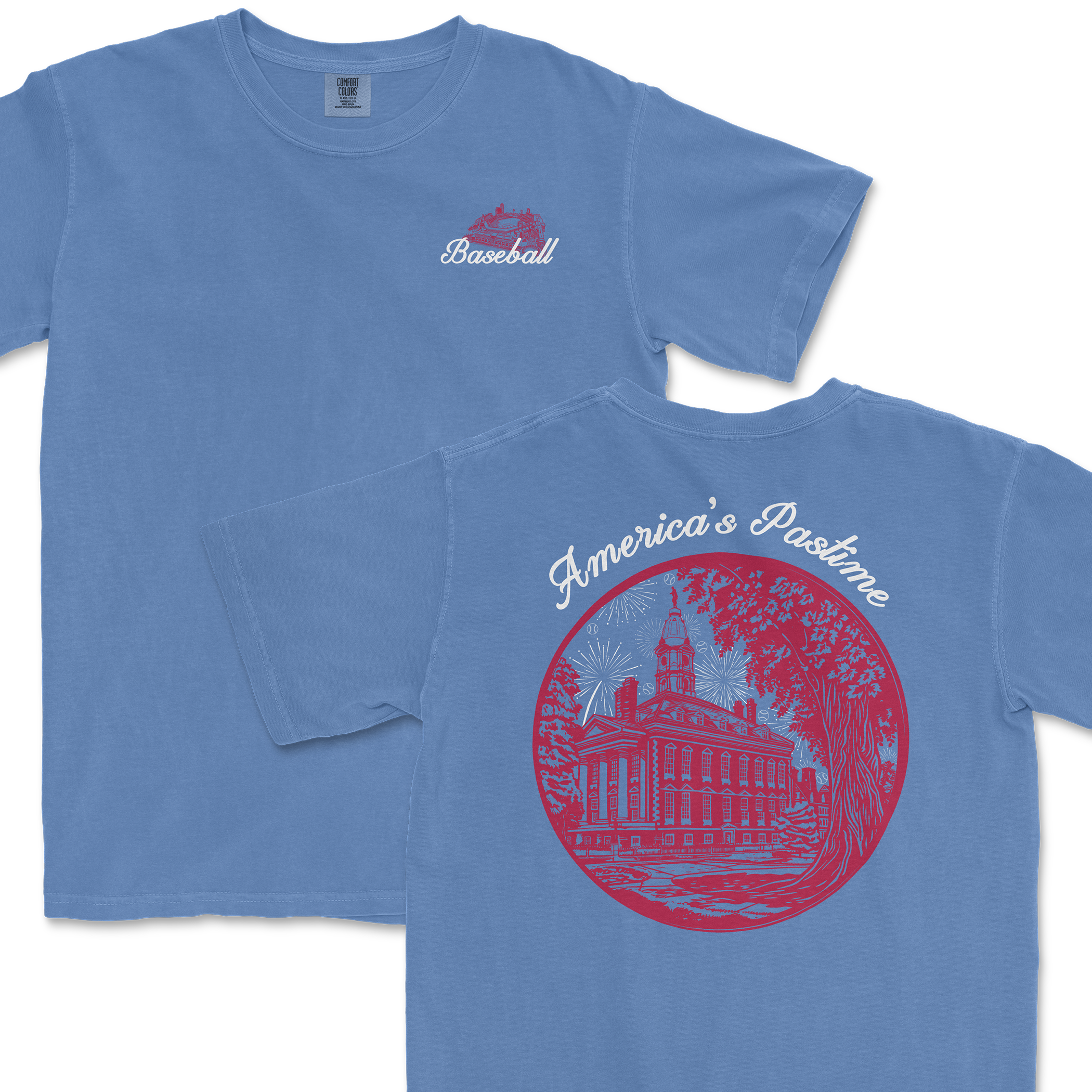 Light blue t-shirt featuring a baseball graphic on the front and a detailed illustration of a historic building with "America's Pastime" text on the back.