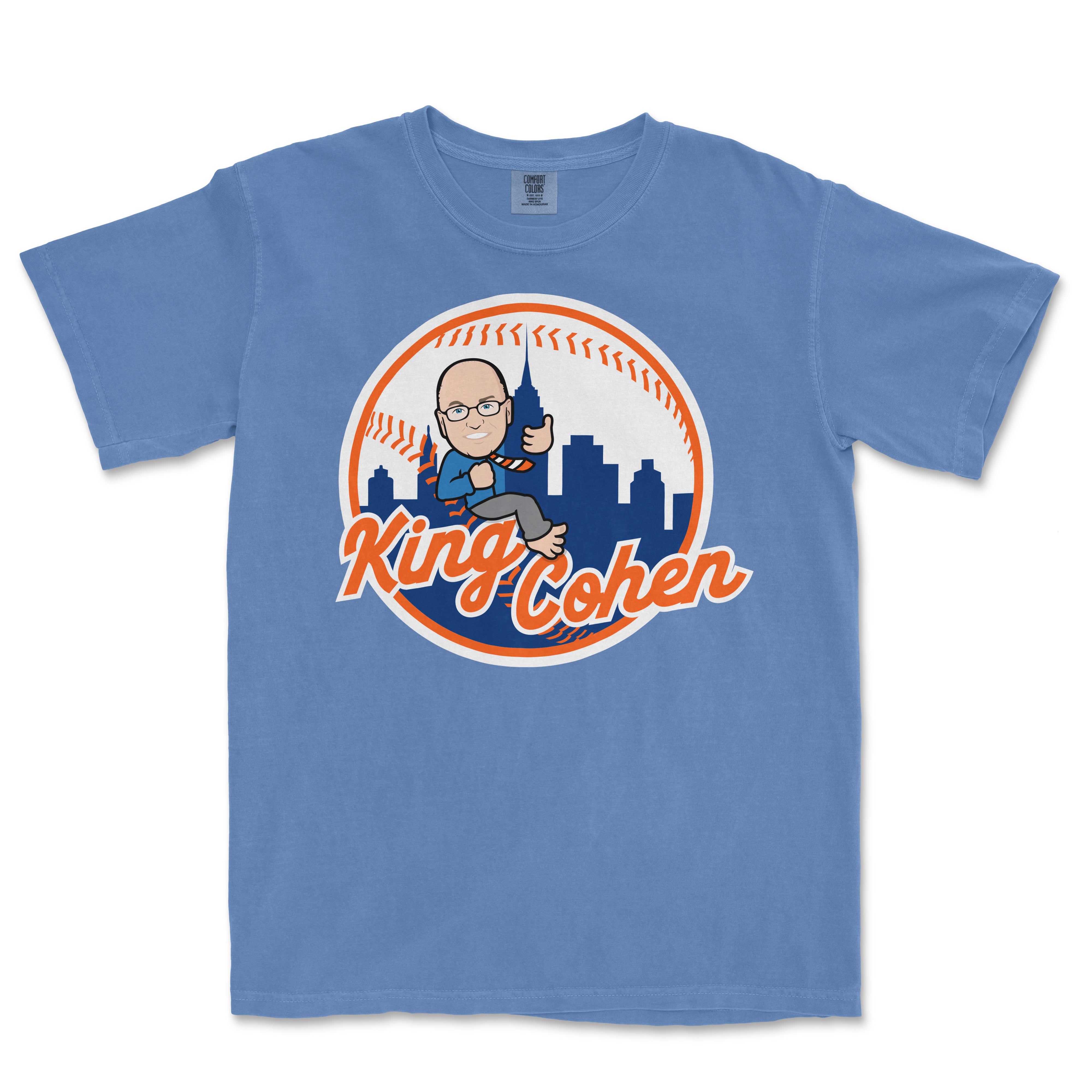 Blue Comfort Colors T-shirt featuring a cartoon graphic of King Cohen holding a walkie-talkie with a city skyline and baseball stitching in the background.