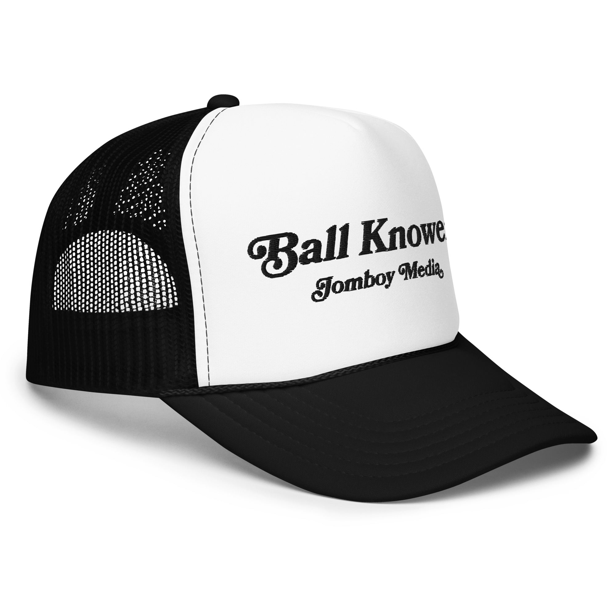 Black and white trucker hat with "Ball Knower" and "Tomboy Media" embroidered on the front panel.