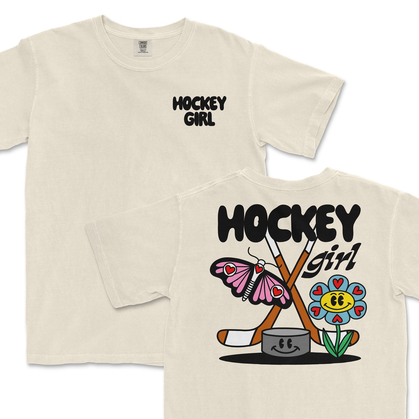 Comfort Colors tee featuring a "Hockey Girl" design with crossed hockey sticks, a smiling flower, and a pink butterfly.