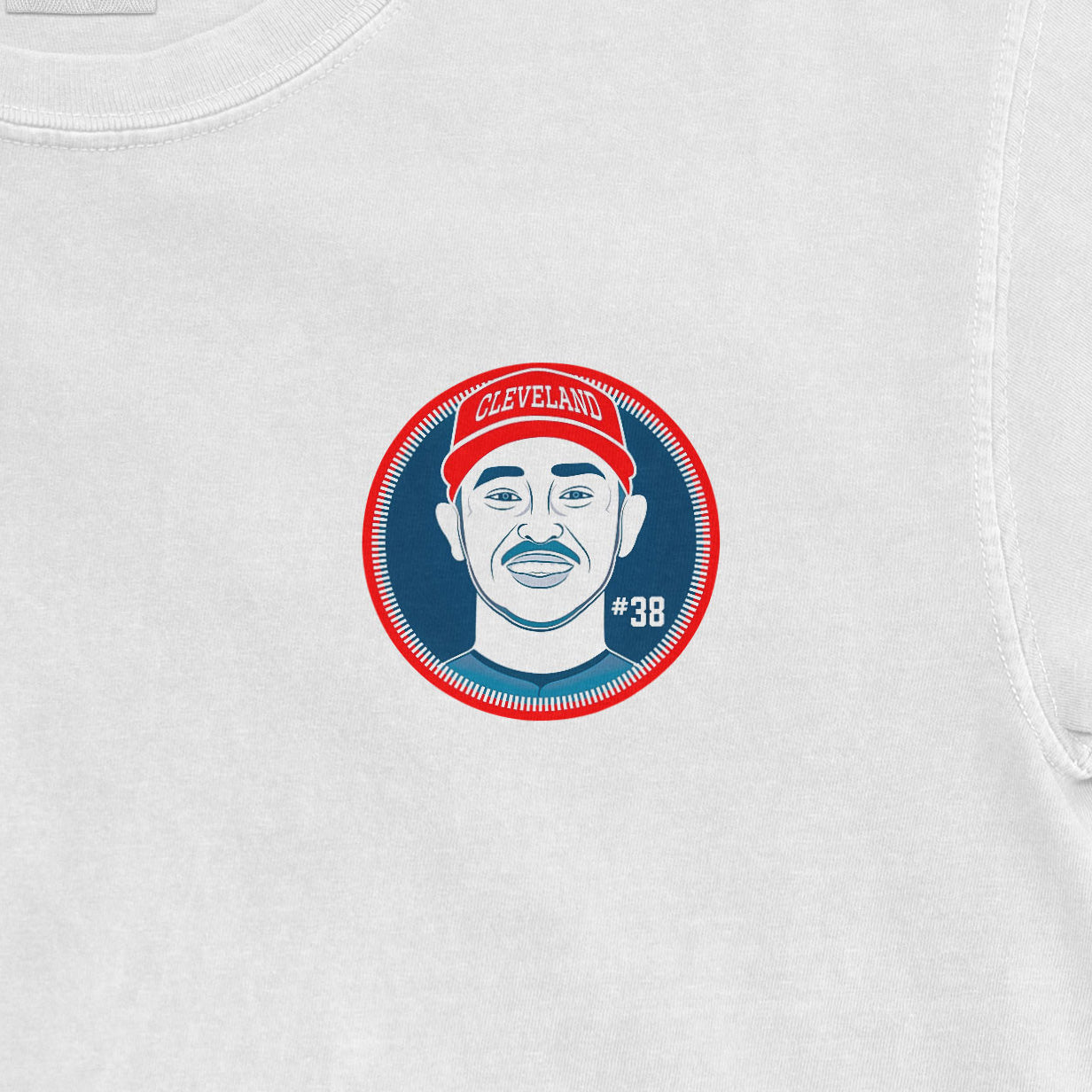 White shirt featuring a Cleveland-themed graphic of Steven Kwan's face, wearing a red cap with "#38" on the side.
