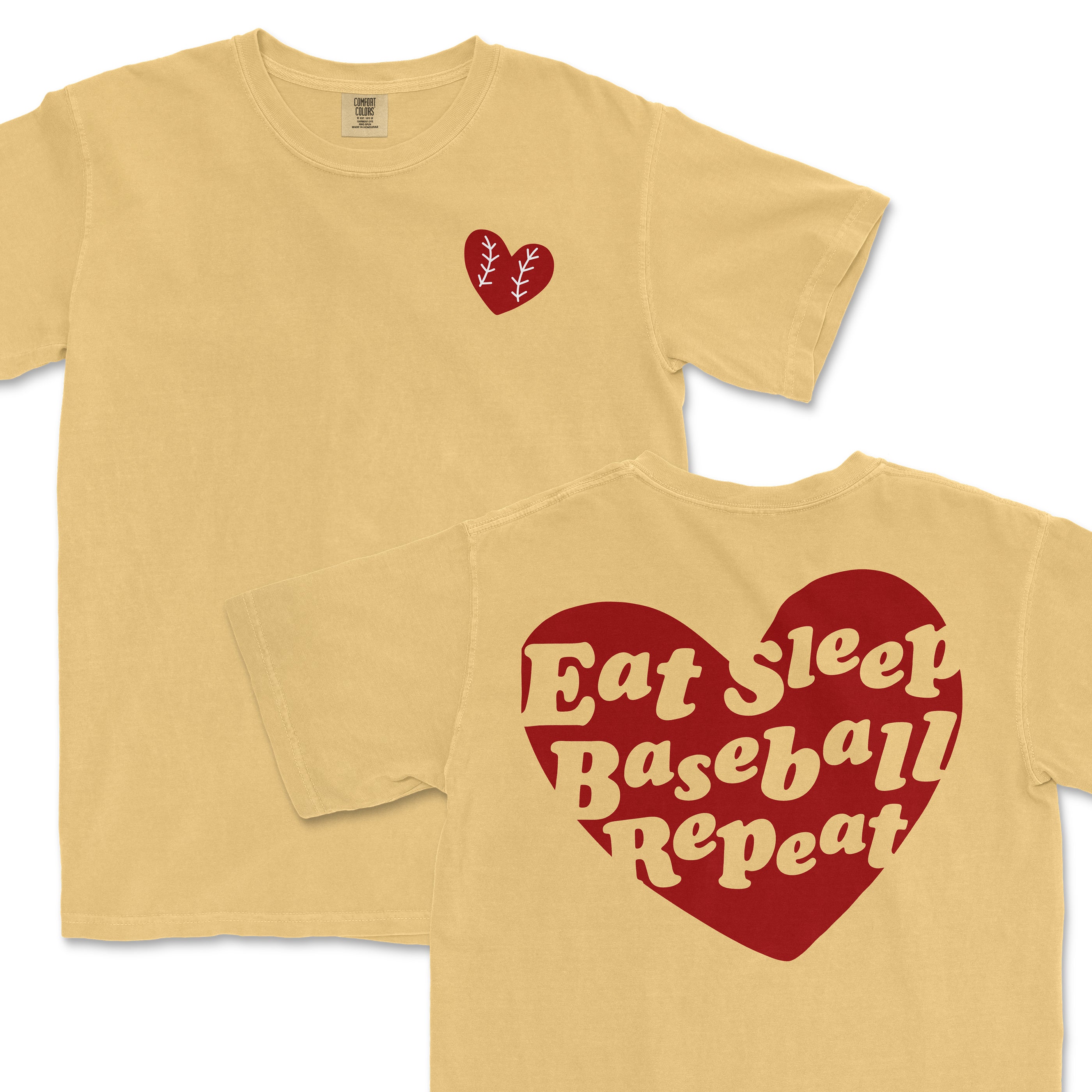 Beige Comfort Colors T-shirt with a small red heart and white baseball stitching on the front; large red heart with "Eat Sleep Baseball Repeat" text on the back.