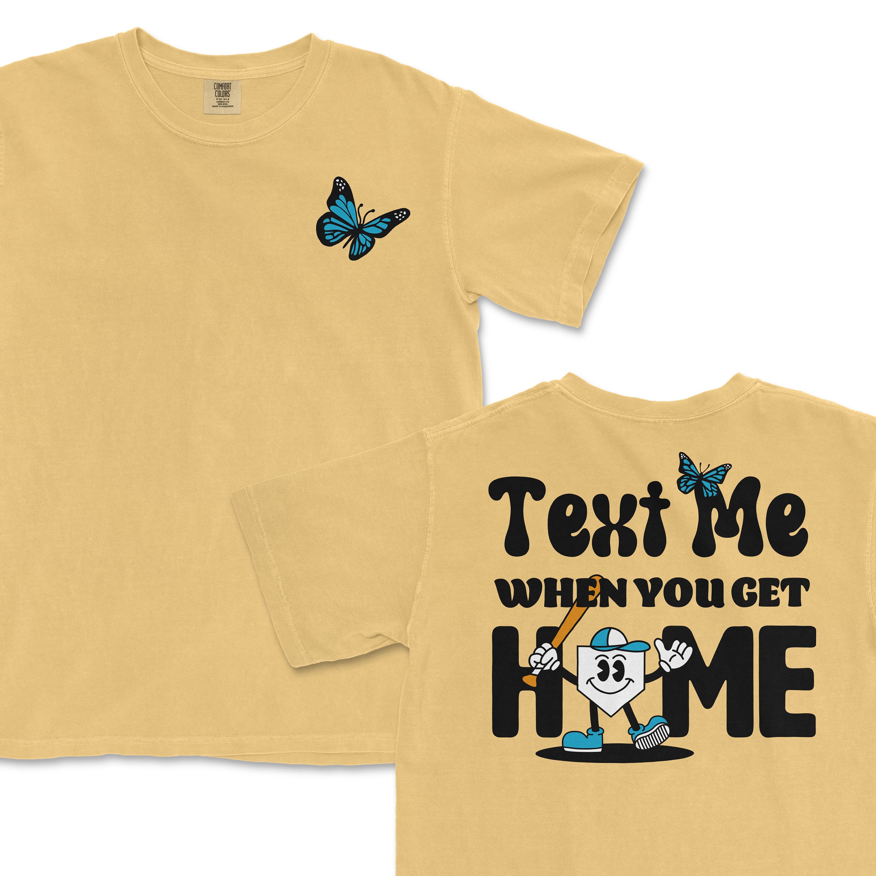 Yellow T-shirt with a blue butterfly on the front and a cartoon house character with a bat, text "Text Me When You Get Home" on the back.