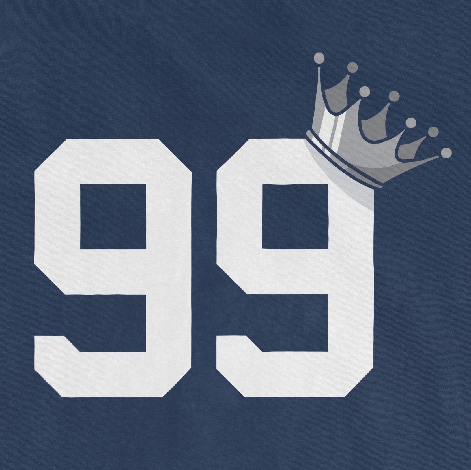 Close-up of a navy Comfort Colors T-shirt with large white number "99" and a gray crown graphic on the top right corner.