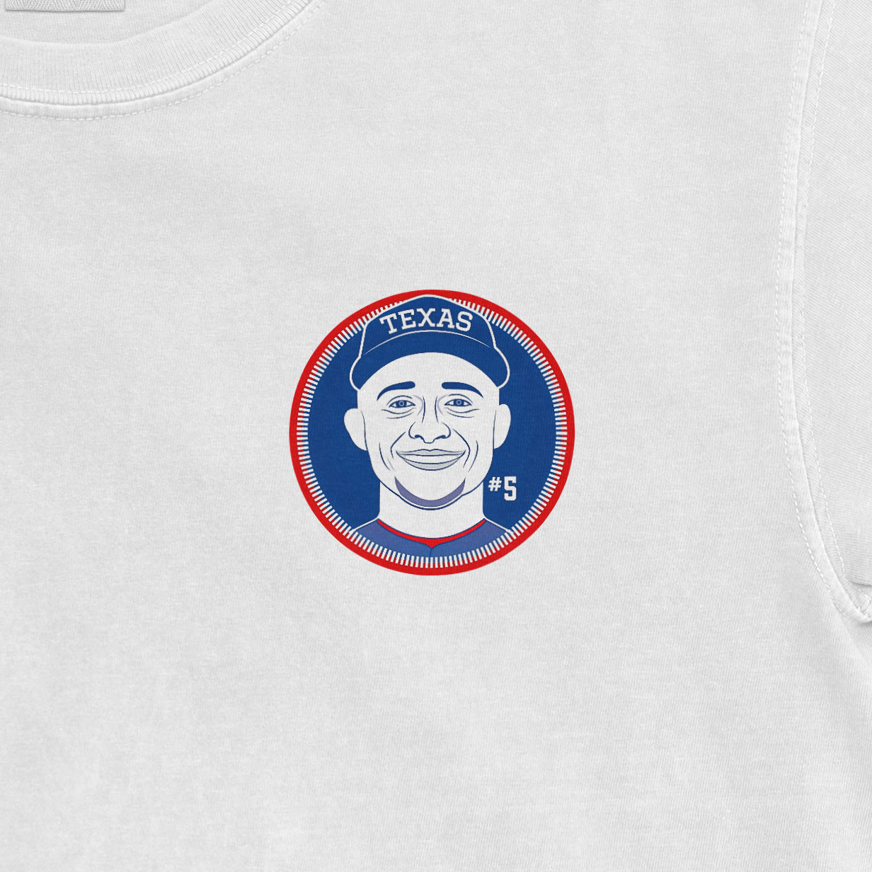 Close-up of a white Comfort Colors tee featuring a Corey Seager Texas Rangers graphic with his face, jersey number 5, and team logo.