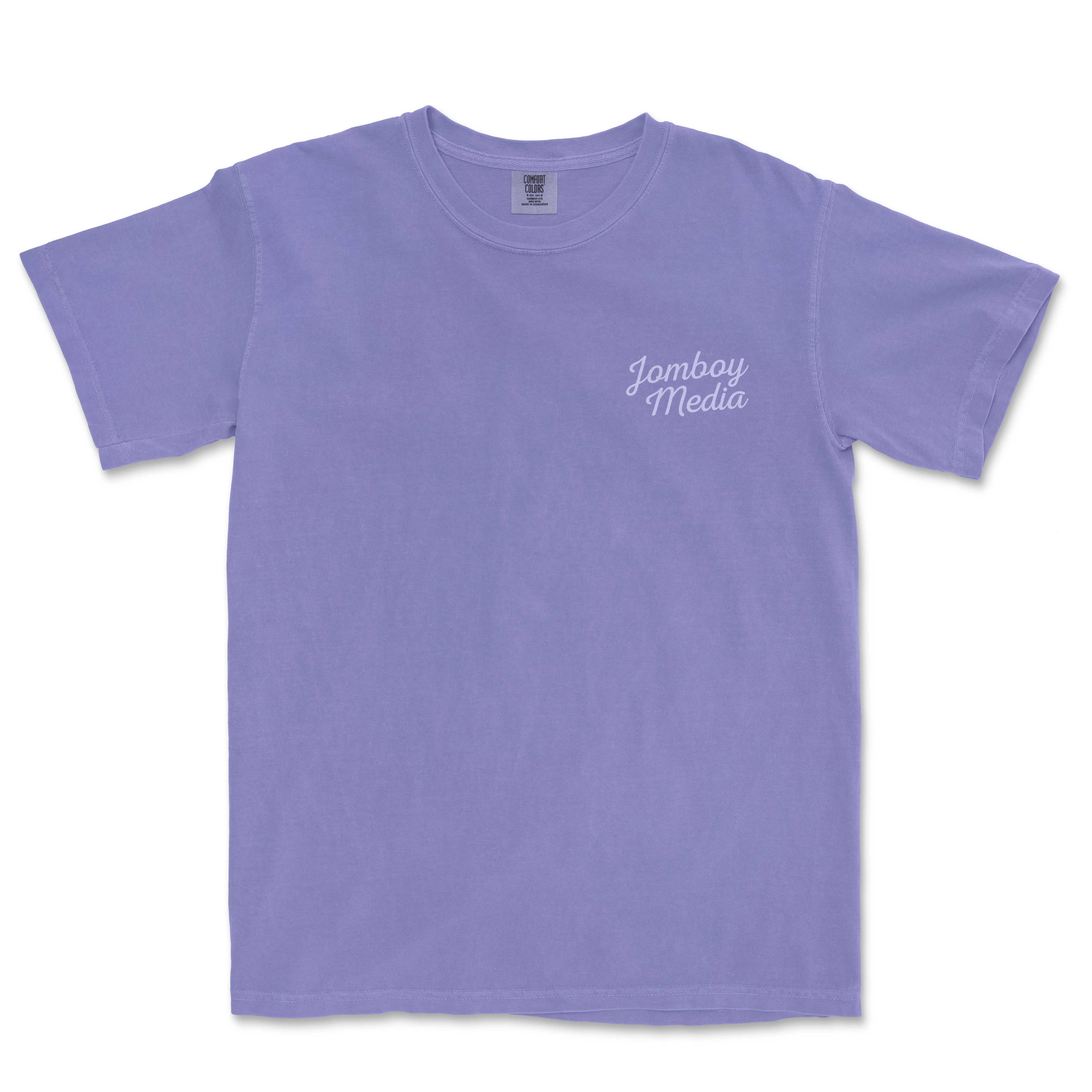 Light purple T-shirt with "Jomboy Media" printed in white cursive on the upper left chest area.