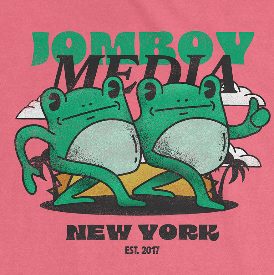 Pink Comfort Colors tee featuring two cartoon frogs with "Jamboy Media" text, "New York" and "Est. 2017" in bold, playful font.