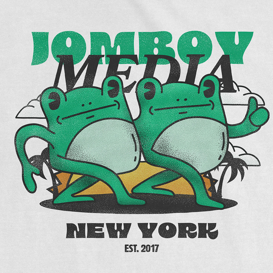 Comfort Colors tee featuring two cartoon frogs with "Jamboy Media" and "New York EST. 2017" text, playful and colorful design.