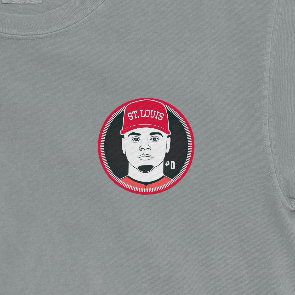 Gray Comfort Colors tee featuring a graphic of Masyn Winn with a red "St. Louis" cap and "#0" on a circular background.