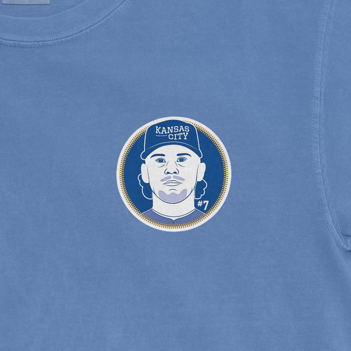 Blue Comfort Colors tee featuring a Bobby Witt Jr. graphic with a Kansas City logo, #7, and a stylized portrait.