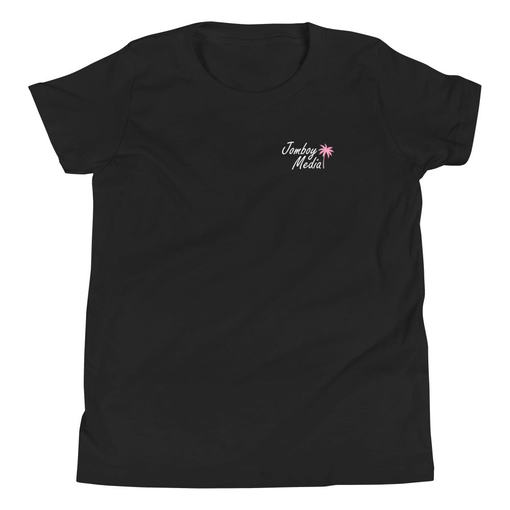 Black youth T-shirt with "Jomboy Media" text and a pink palm tree graphic on the upper left chest area.