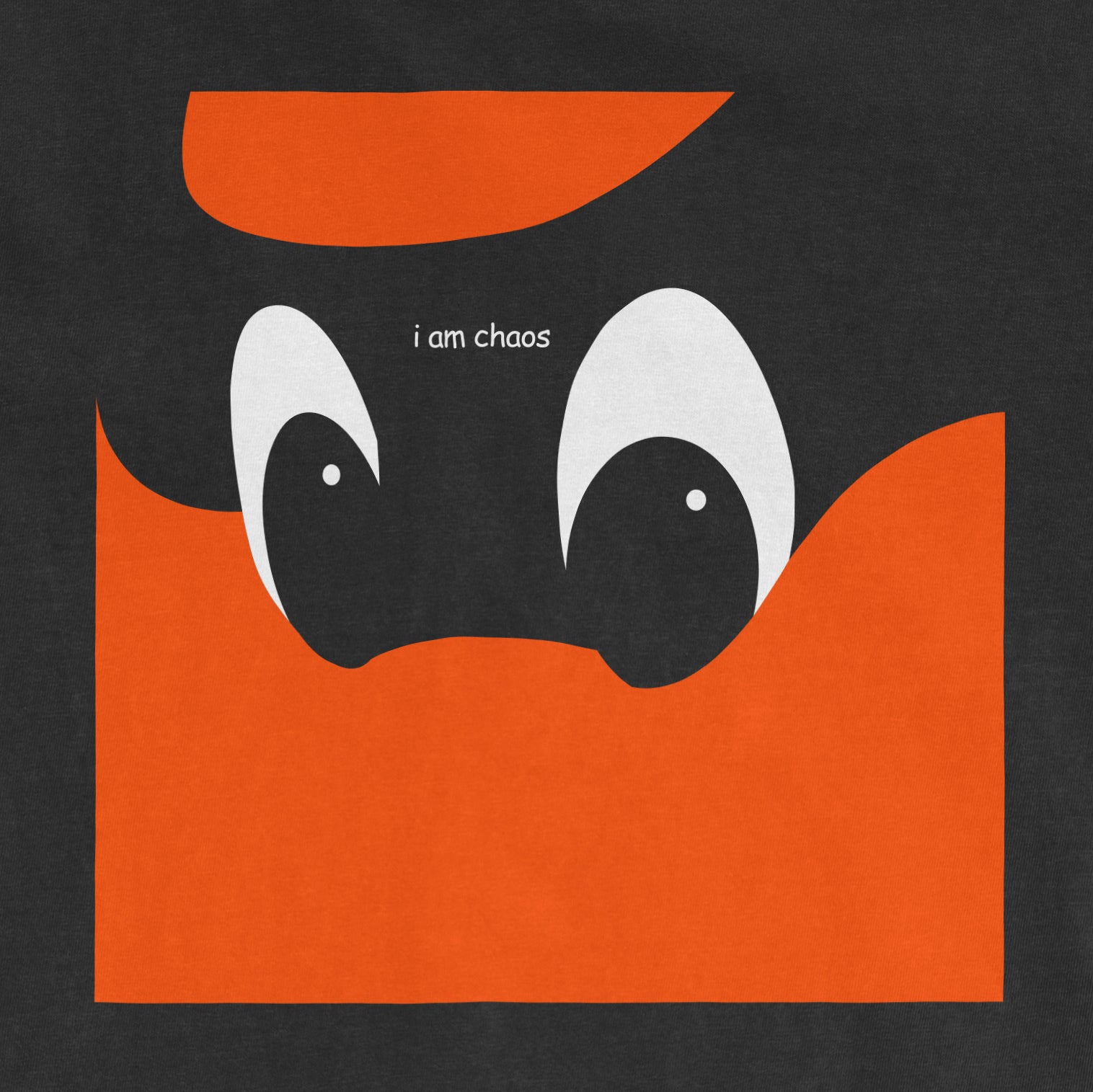 Black Comfort Colors T-shirt featuring a cartoon pumpkin with large eyes and the phrase "i am chaos" above it.