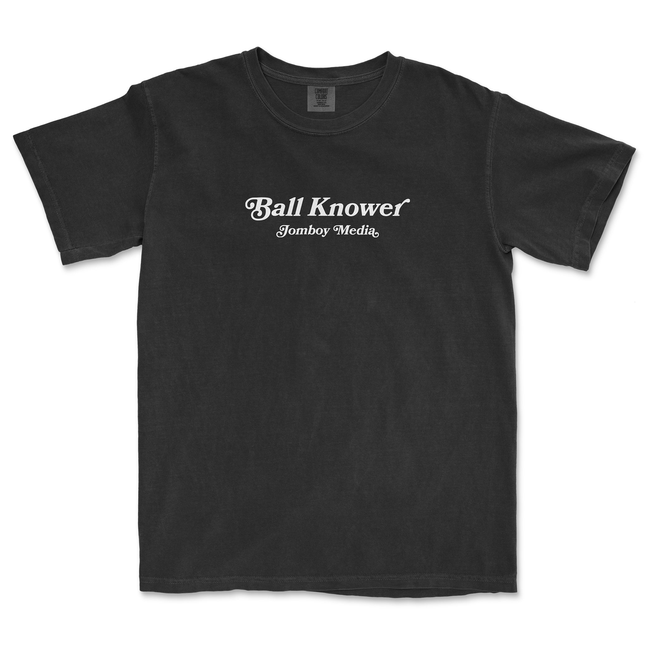 Black Comfort Colors T-shirt with white "Ball Knower" and "Jomboy Media" text printed on the front.