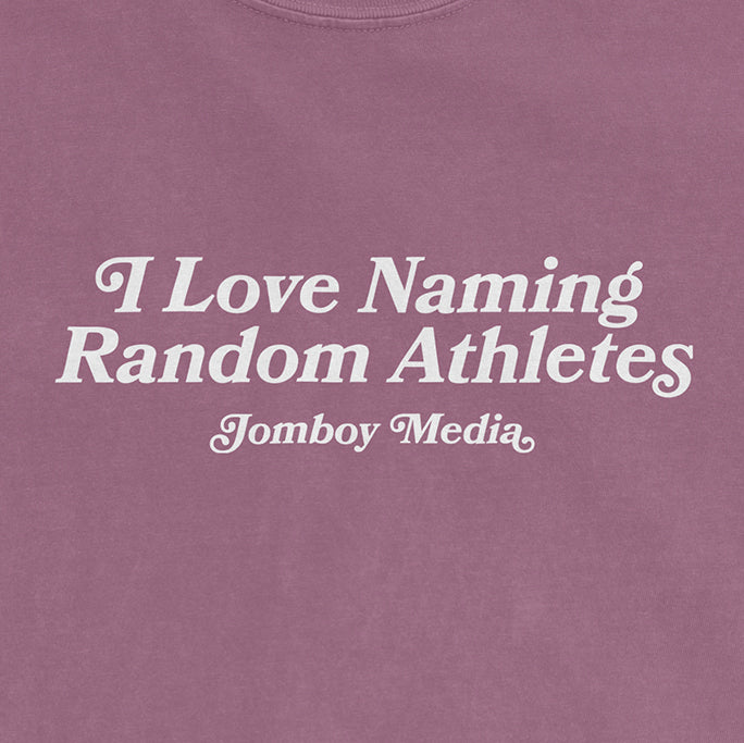 Pink Comfort Colors tee featuring white text that reads "I Love Naming Random Athletes" and "Jomboy Media.