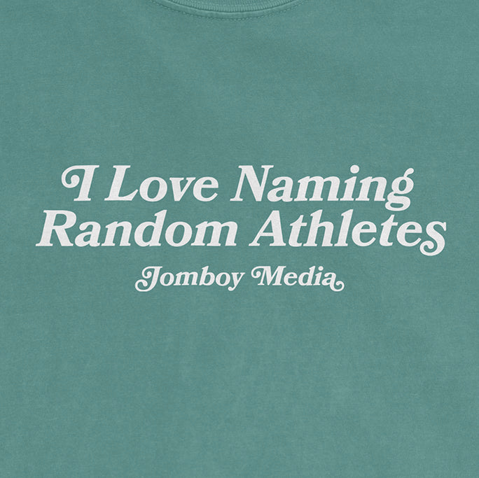 Comfort Colors teal tee with white text that reads, "I Love Naming Random Athletes" by Jomboy Media.