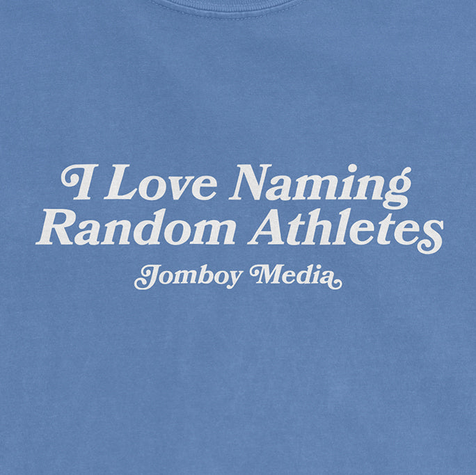 Blue Comfort Colors tee with white text that reads "I Love Naming Random Athletes" and "Jomboy Media" below.