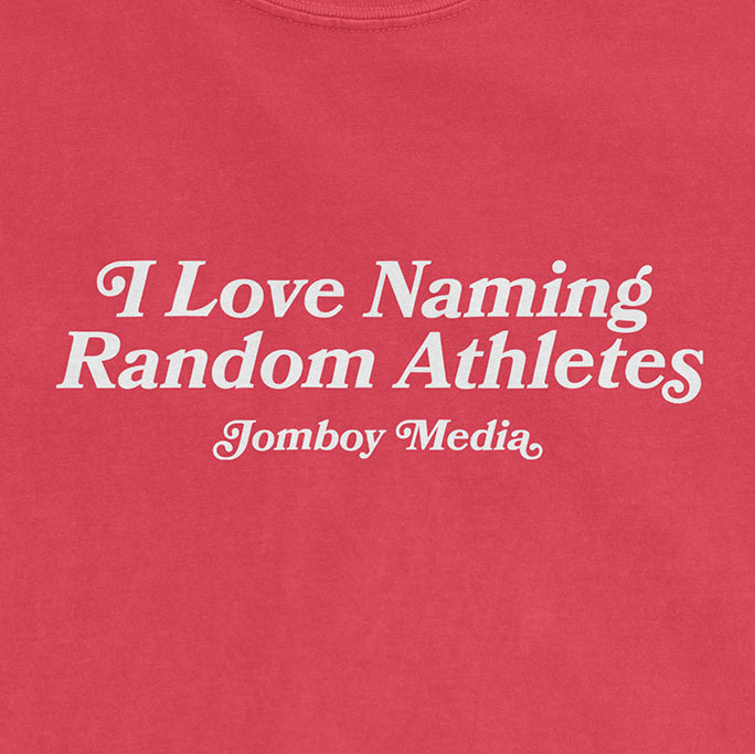 Pink Comfort Colors tee with white text that reads "I Love Naming Random Athletes" and "Jomboy Media.