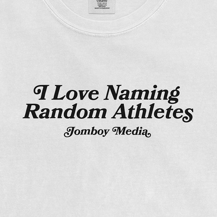 White Comfort Colors T-shirt with black text that reads "I Love Naming Random Athletes" and "Jomboy Media.