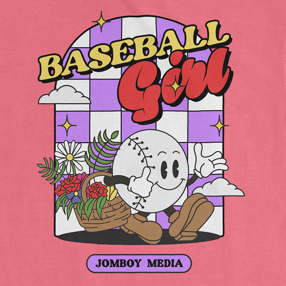 Pink Comfort Colors tee featuring a cartoon baseball character with flowers, clouds, and "Baseball Girl" text in bold, playful font.