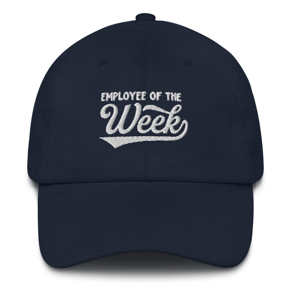 Navy blue dad hat with white embroidered text reading "Employee Of The Week" on the front.