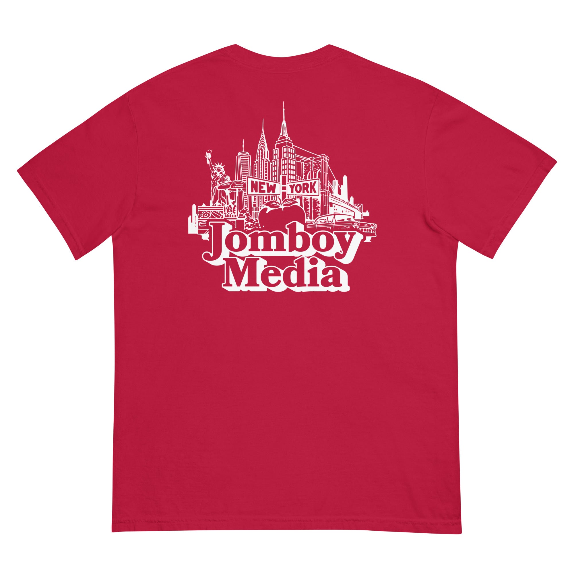 Red T-shirt featuring a white line art illustration of New York City skyline with "Jomboy Media" logo and "New York" text.