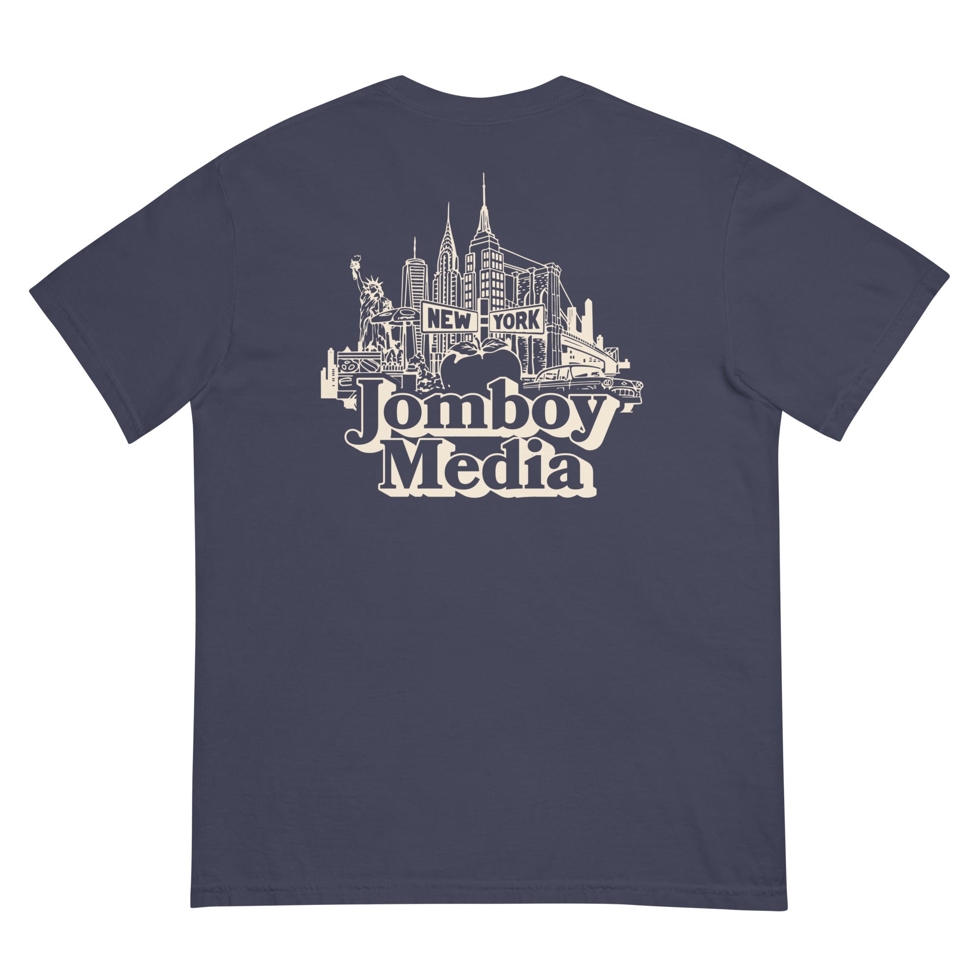Back of navy T-shirt featuring a white line art illustration of New York City skyline with "Jomboy Media" text below.