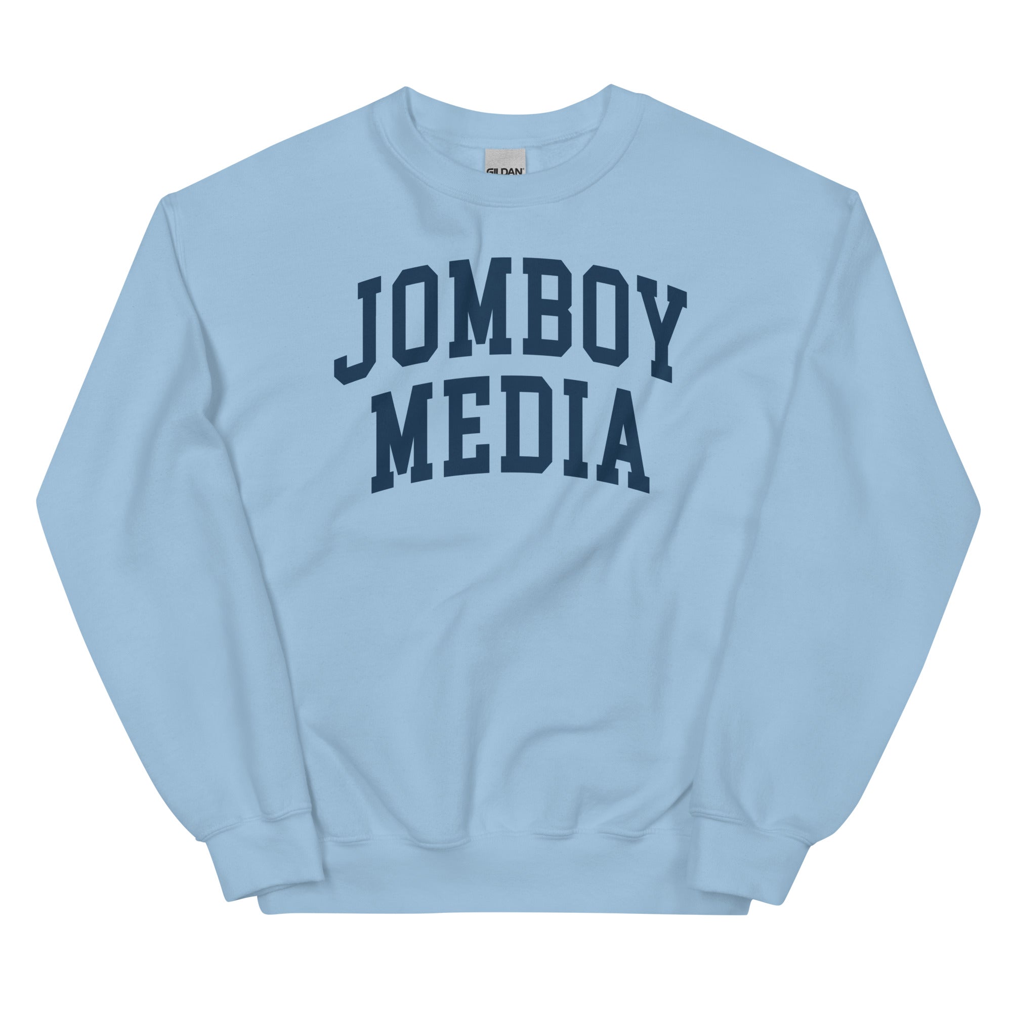 Light blue sweatshirt with bold navy "JOMBOY MEDIA" text printed on the front in a collegiate style font.