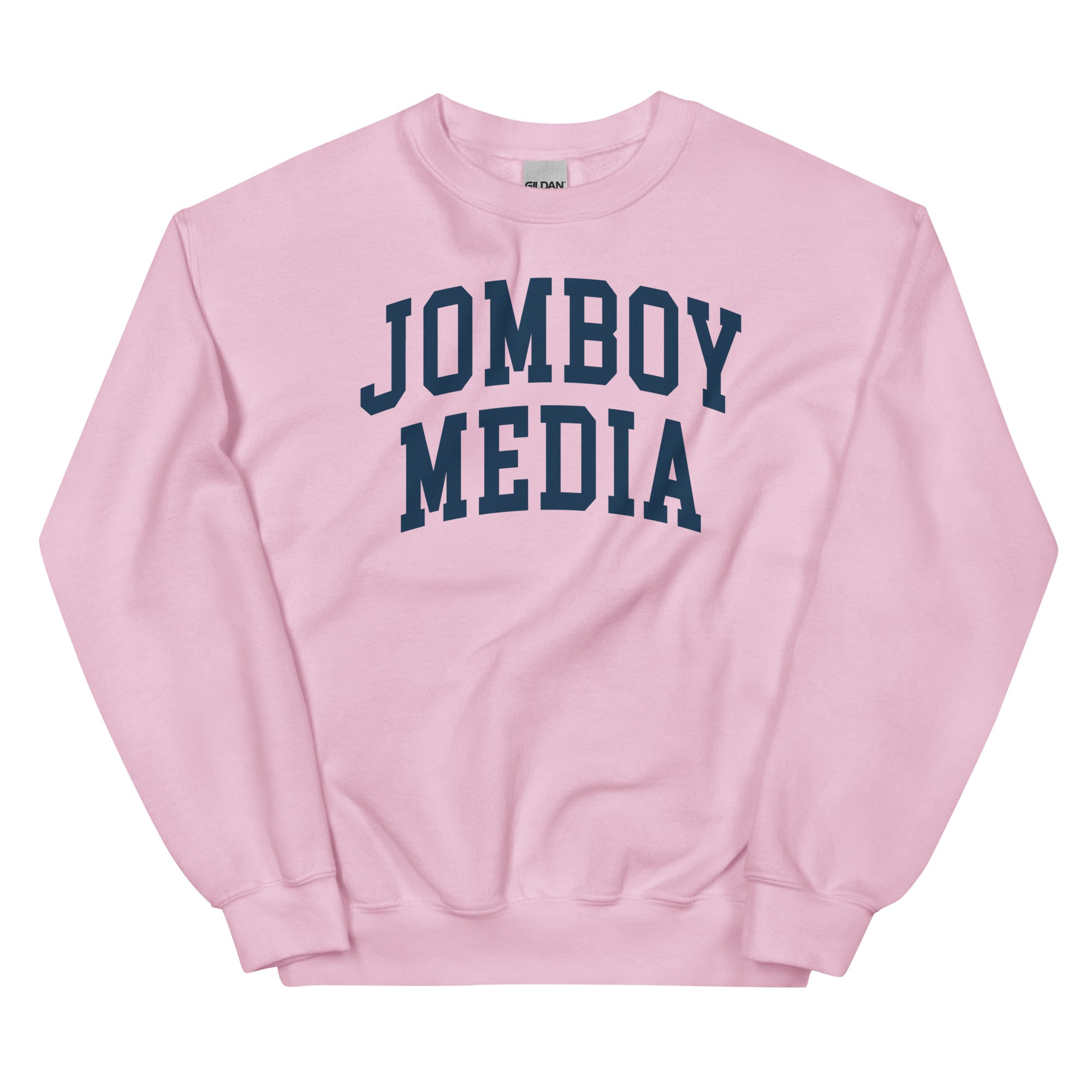 Pink sweatshirt with bold navy "JOMBOY MEDIA" text printed across the front. Casual, comfortable streetwear style.