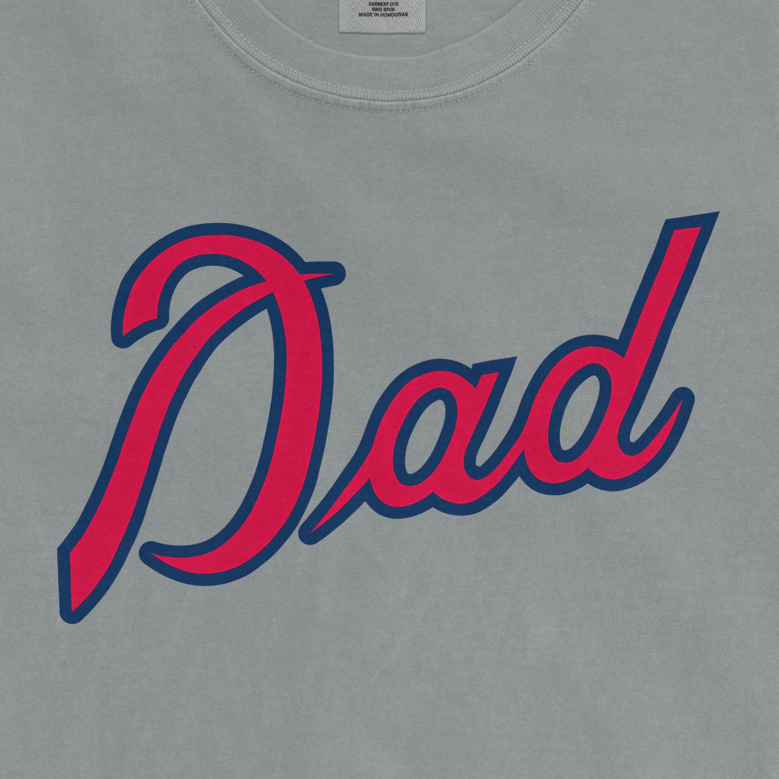 Comfort Colors tee featuring "Dad" in bold red and navy script, celebrating Atlanta baseball dads.