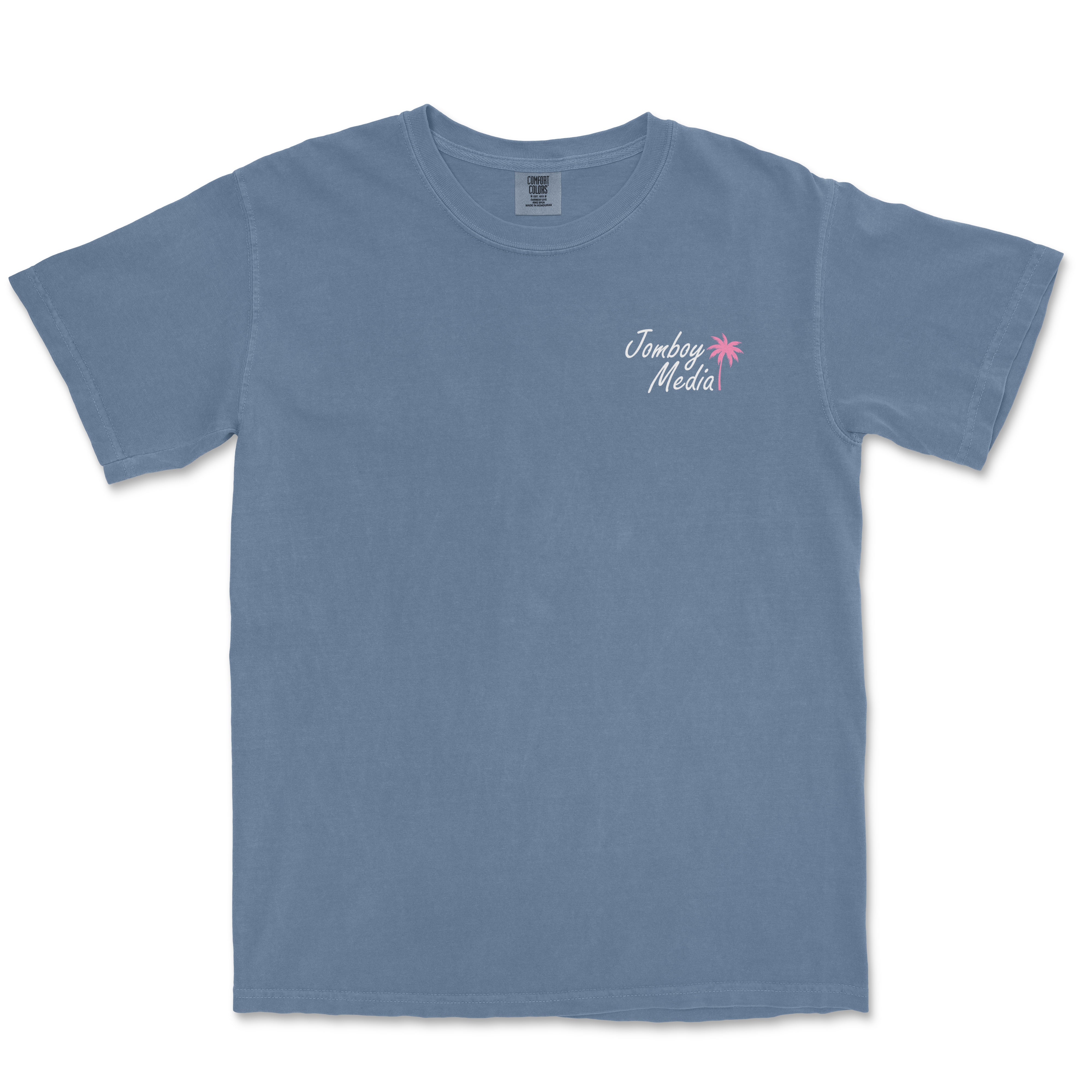 Blue Comfort Colors T-shirt featuring a small "Jomboy Media" logo with a pink palm tree on the upper left chest area.