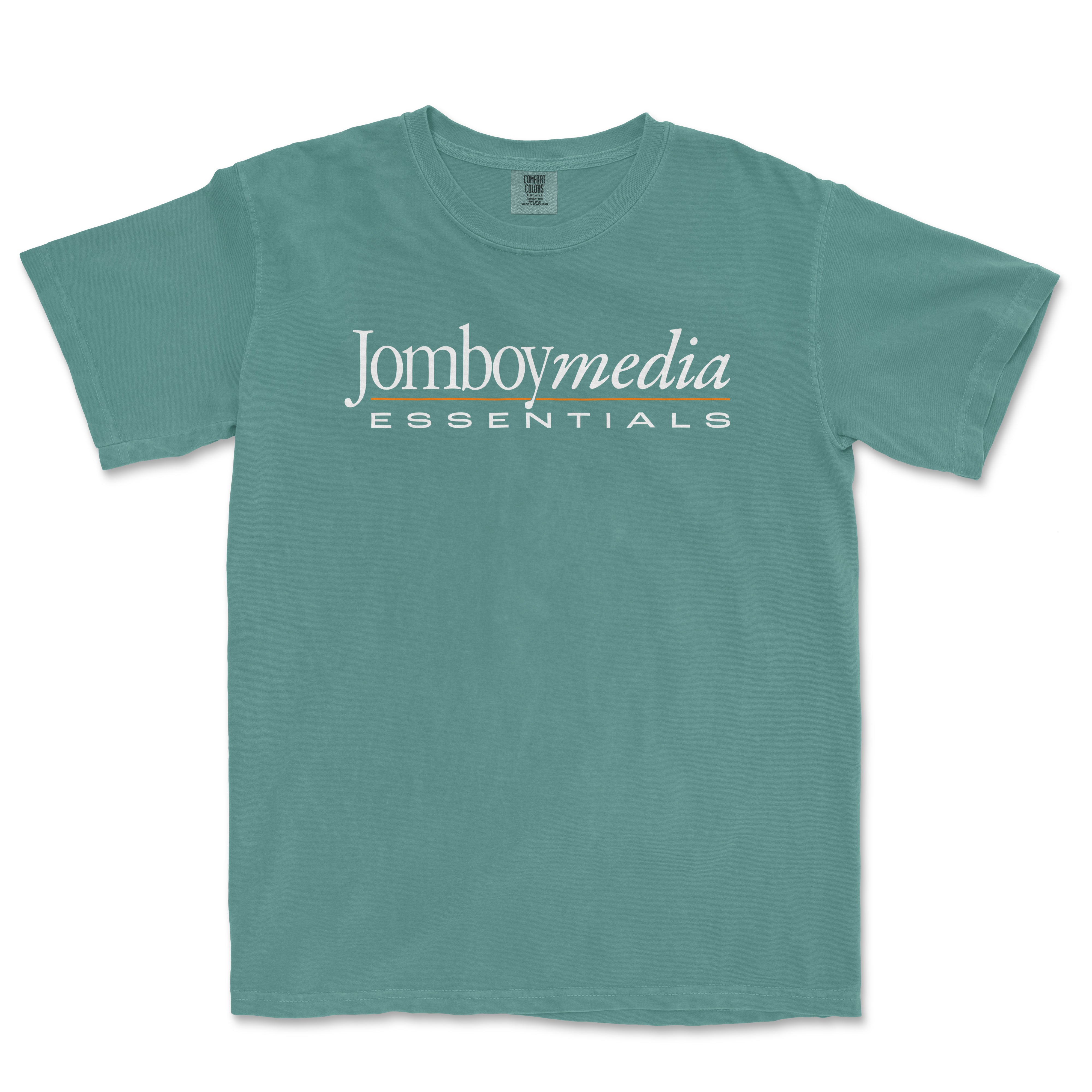 A teal T-shirt featuring the "Jomboymedia Essentials" logo in white and orange text across the front.