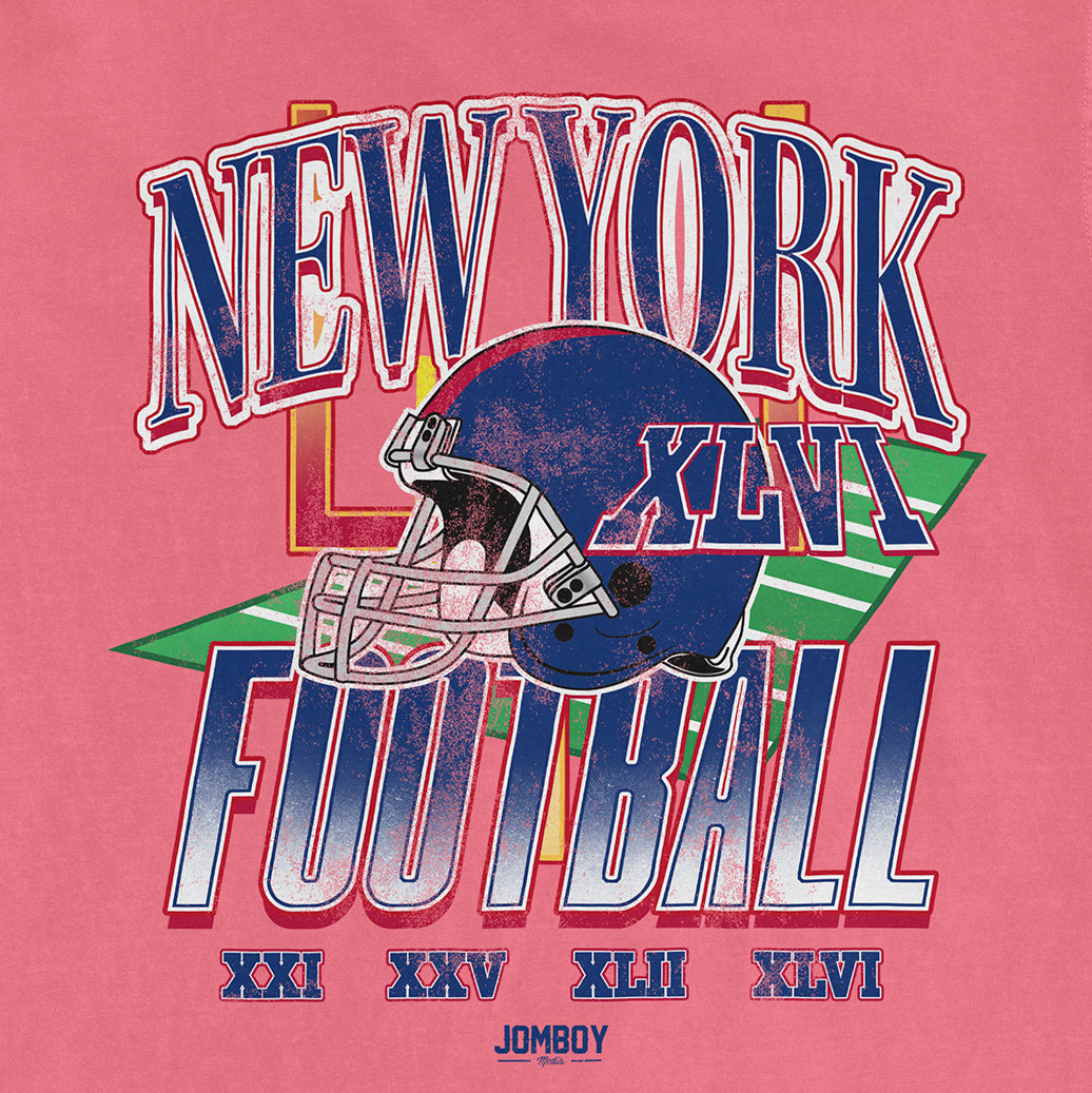 Pink vintage Comfort Colors® tee featuring a New York Giants football helmet, bold "NEW YORK FOOTBALL" text, and Roman numerals.