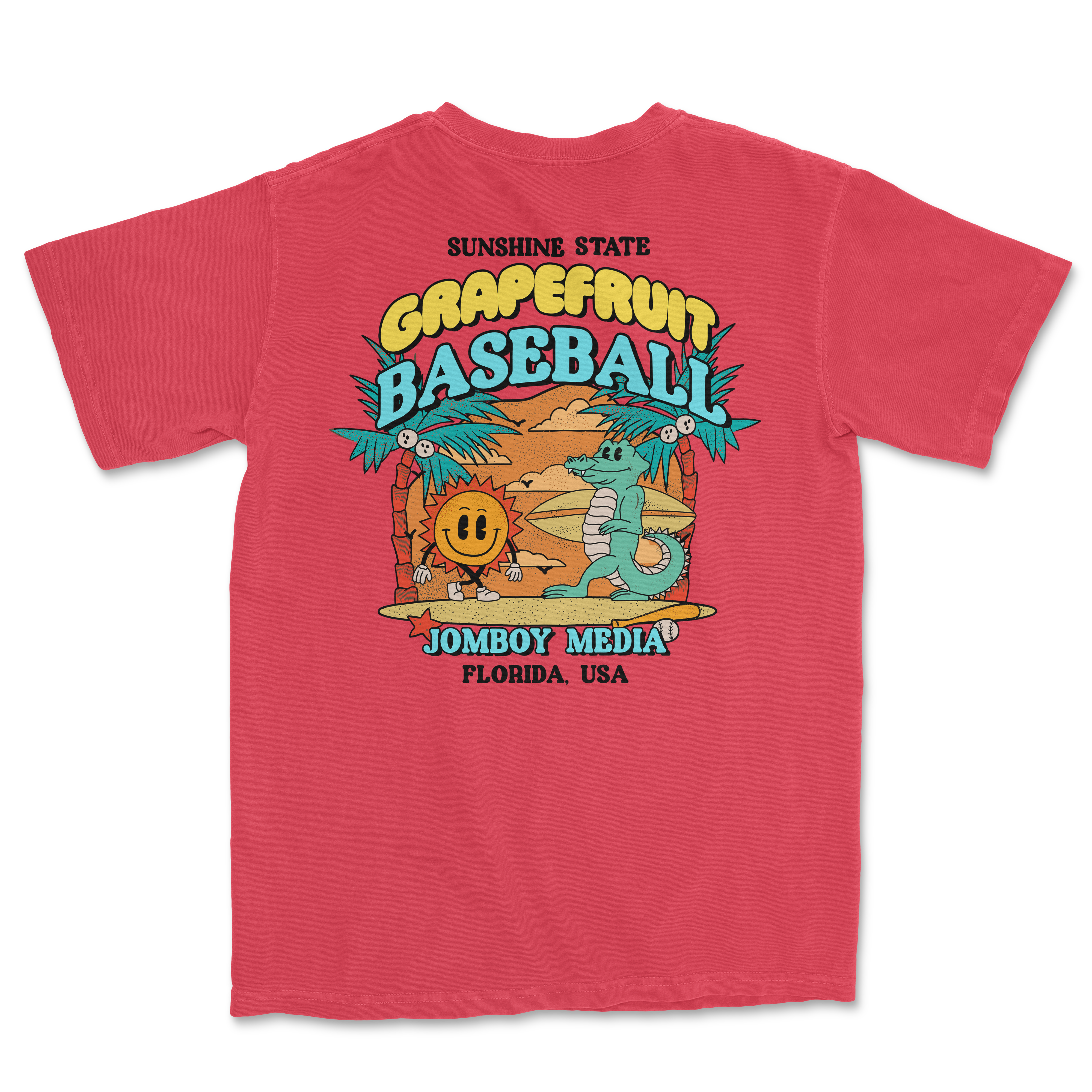 Pink Comfort Colors T-shirt featuring a colorful grapefruit baseball graphic with a sun, palm trees, and playful characters.