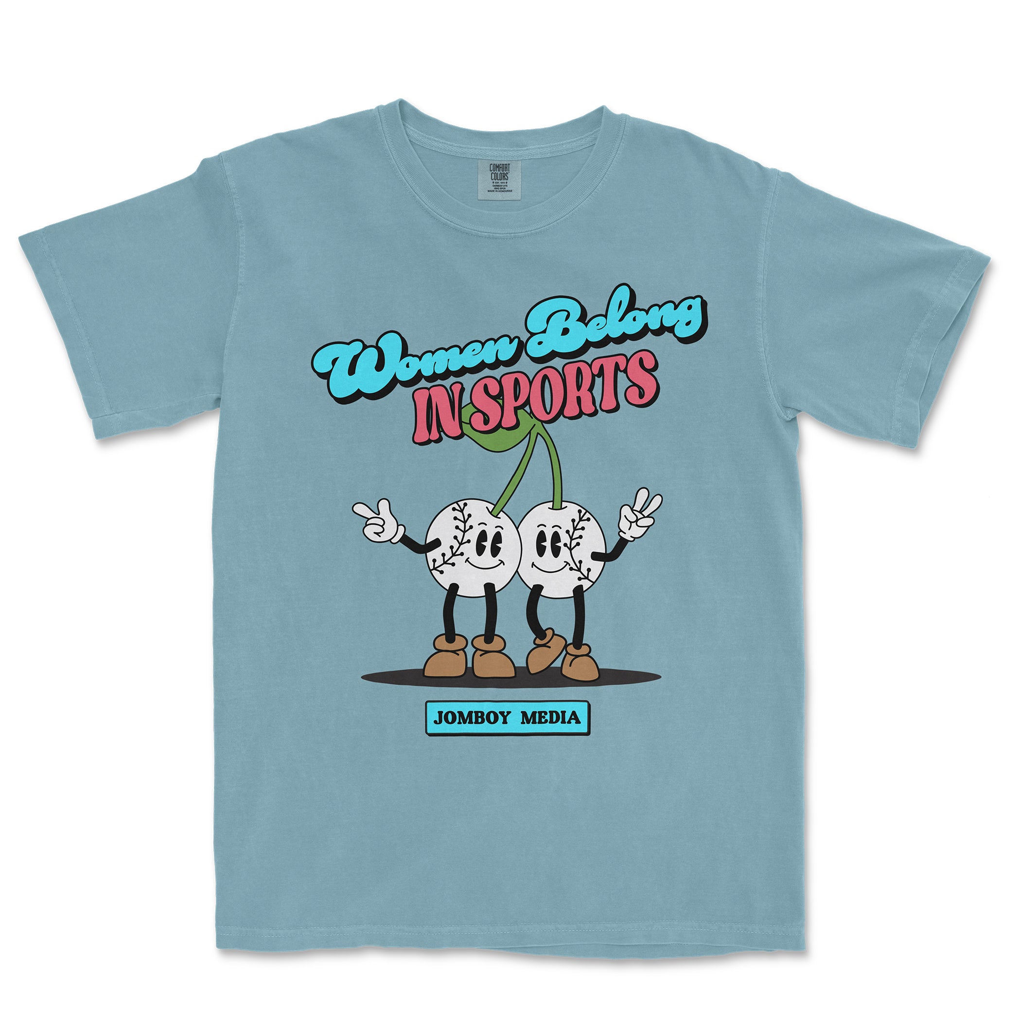 Light blue T-shirt with cartoon baseball characters, colorful text "Women Belong in Sports," and "Jombo Media" label.